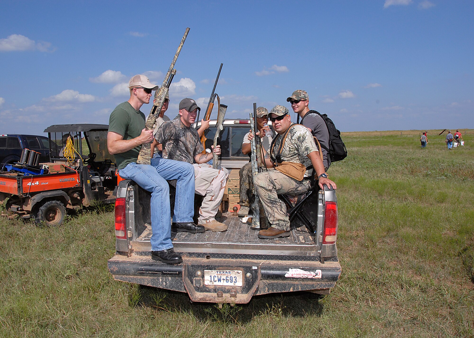 Participants in the 6th Annual Clay County Dove Salute Sept. 11 at the Birdwell-Clark Ranch in Henrietta, Texas, load into a truck to be taken to the site where they will hunt dove.  In addition to the Birdwell-Clark Ranch, two other ranches opened up their land to support the military member dove hunt.  (U.S. Air Force photo/Harry Tonemah)