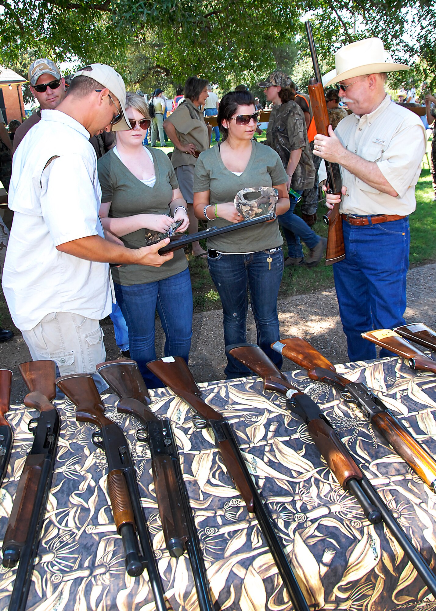 Shotguns lay on a table, waiting for participants in the 6th Annual Clay County Dove Salute Sept. 11 at the Birdwell-Clark Ranch in Henrietta, Texas.  Weapons and ammunition were donated by businesses and community members in Clay County.  Sheppard members were given a safety brief before going on the hunt.  (U.S. Air Force photo/Harry Tonemah)