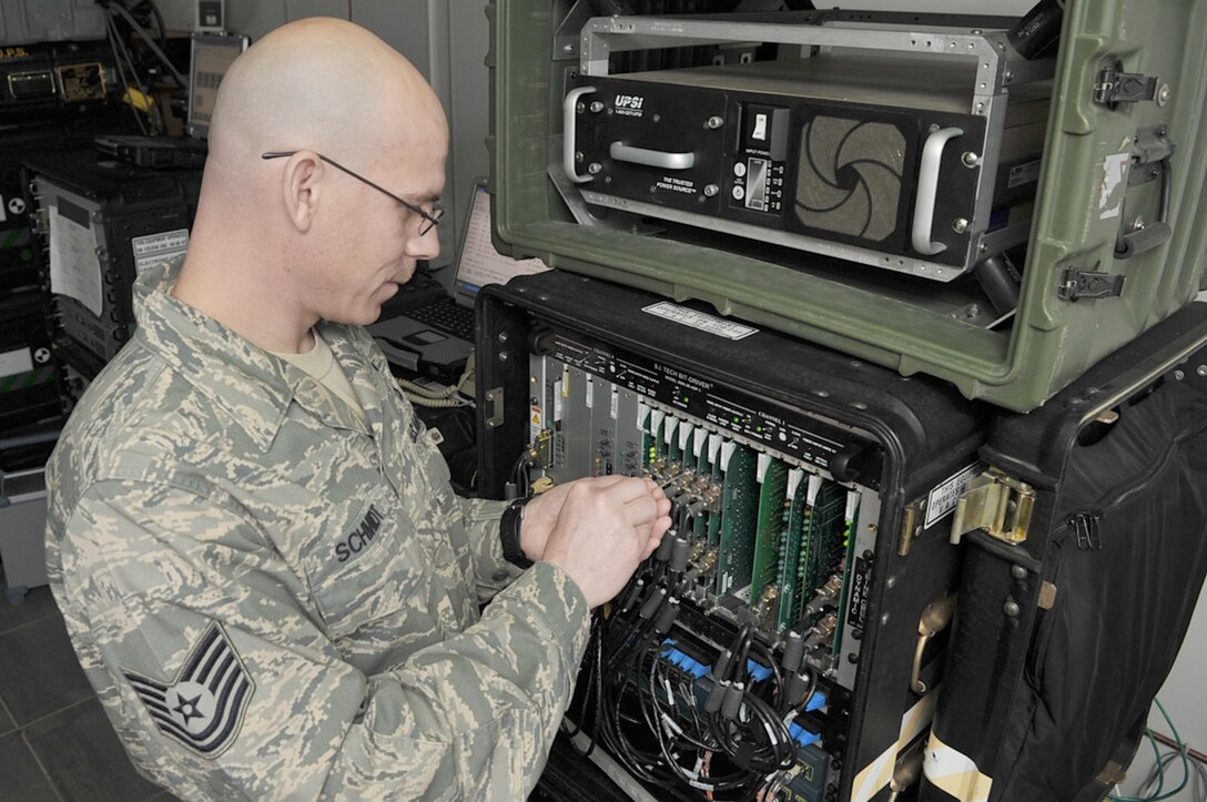 Tech. Sgt. Dennis Schmidt makes adjustments to a basic access module used to manage defense system network lines, Feb. 9, 2010, at the Krtsanisi National Training Center, Georgia. Sergeant Schmidt is a transmission system technician with the 1st Combat Communications Squadron. (U.S. Air Force photo/Senior Airman Tony R. Ritter) 
