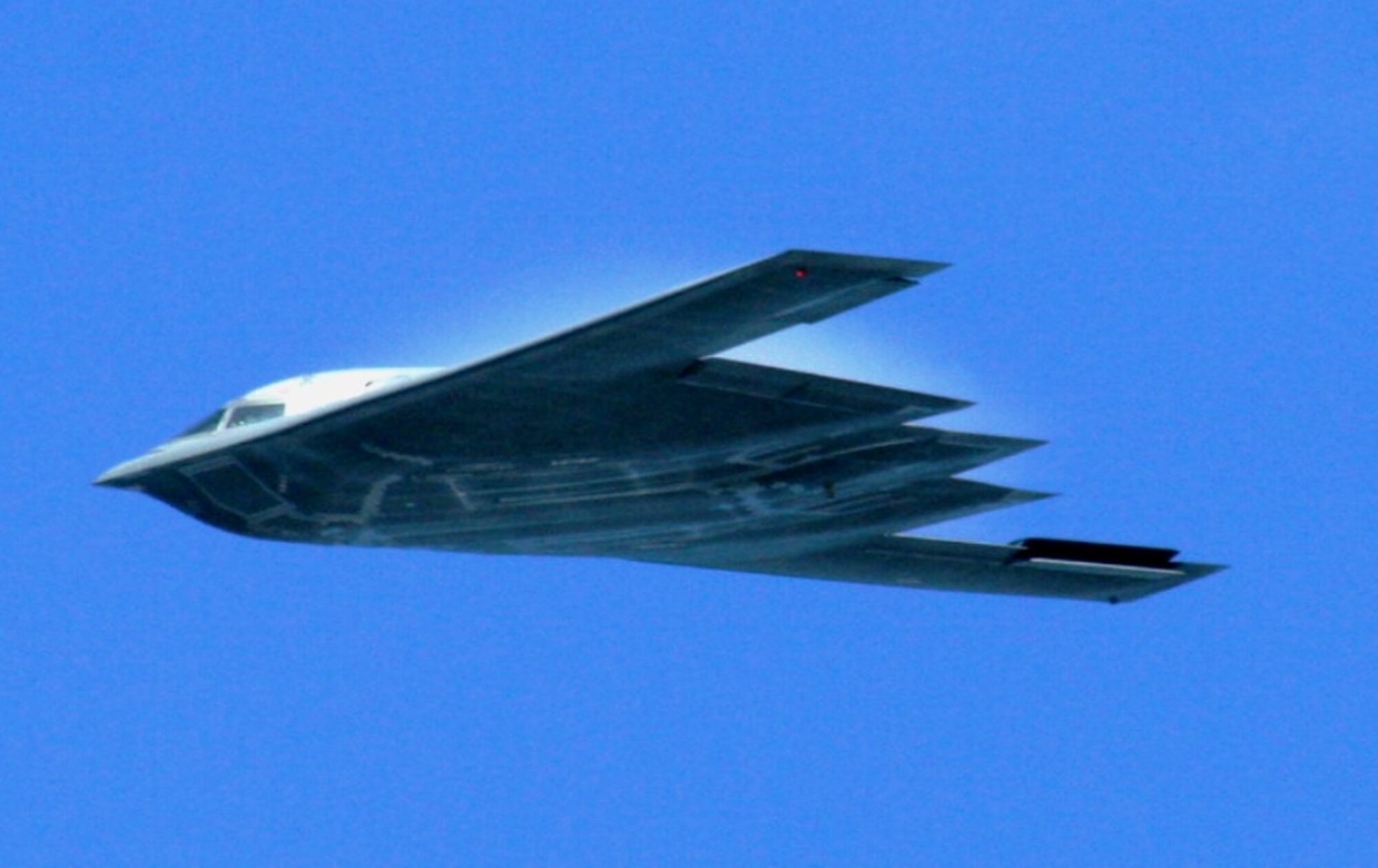 An aircrew flies a B-2 Spirit from Whiteman Air Force Base, Mo., over the airfield as part of an aerial demonstration for the 2010 Airpower Over The Midwest Airshow on Sept. 11, 2010, at Scott AFB, Ill. Tens of thousands of people attended the two-day airshow. (U.S. Air Force Photo/Master Sgt. Scott T. Sturkol)
