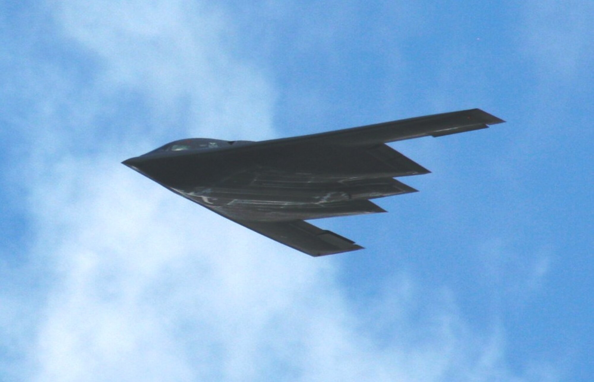An aircrew flies a B-2 Spirit from Whiteman Air Force Base, Mo., over the airfield as part of an aerial demonstration for the 2010 Airpower Over The Midwest Airshow on Sept. 11, 2010, at Scott AFB, Ill. Tens of thousands of people attended the two-day airshow. (U.S. Air Force Photo/Master Sgt. Scott T. Sturkol)