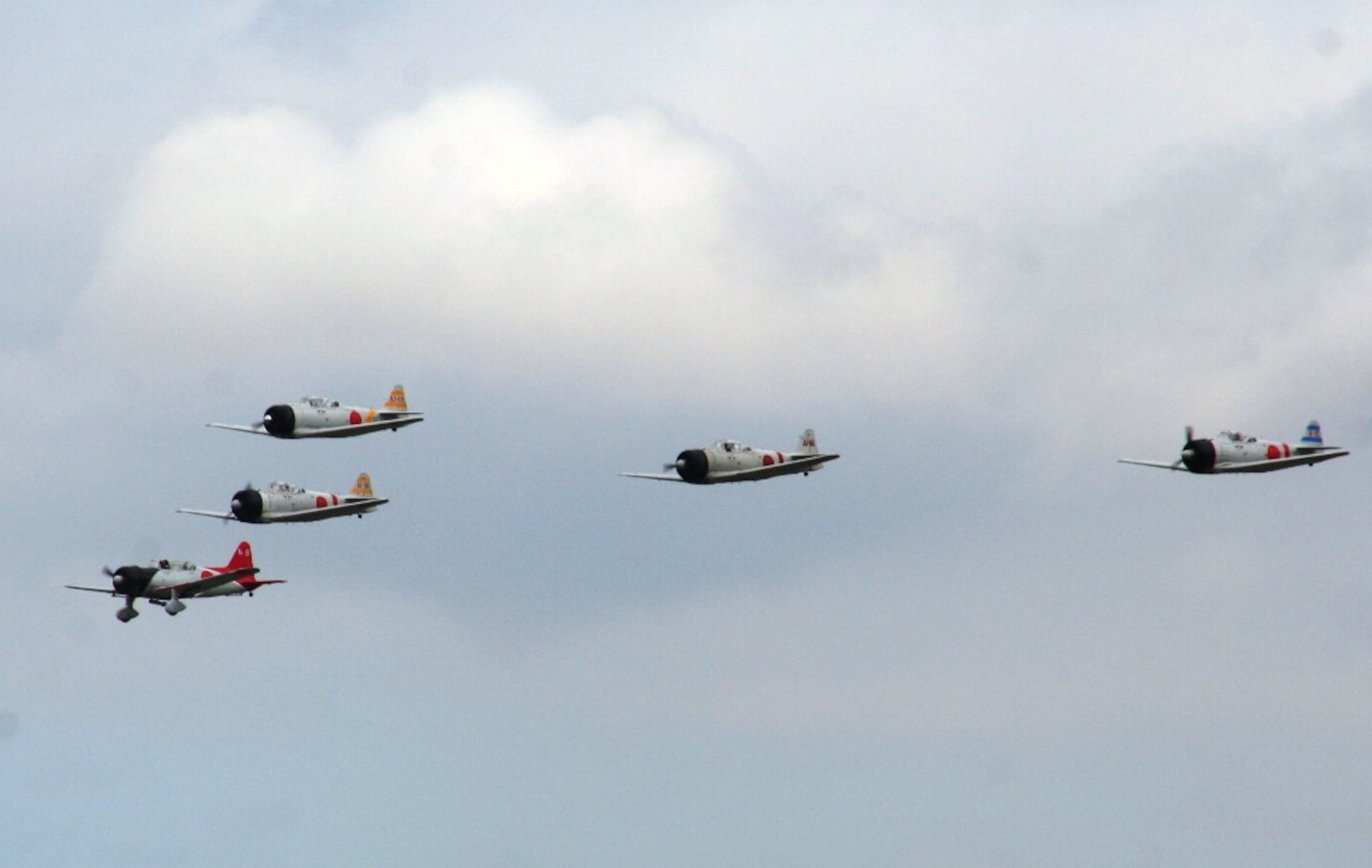 Vintage World War II-era aircraft flies through the air during the "Tora! Tora! Tora!" aerial demonstration by the Commemorative Air Force for the 2010 Airpower Over The Midwest Airshow on Sept. 11, 2010, at Scott Air Force Base, Ill. The demonstration re-enacts the Pearl Harbor attack. Tens of thousands of people attended the two-day airshow. (U.S. Air Force Photo/Master Sgt. Scott T. Sturkol)