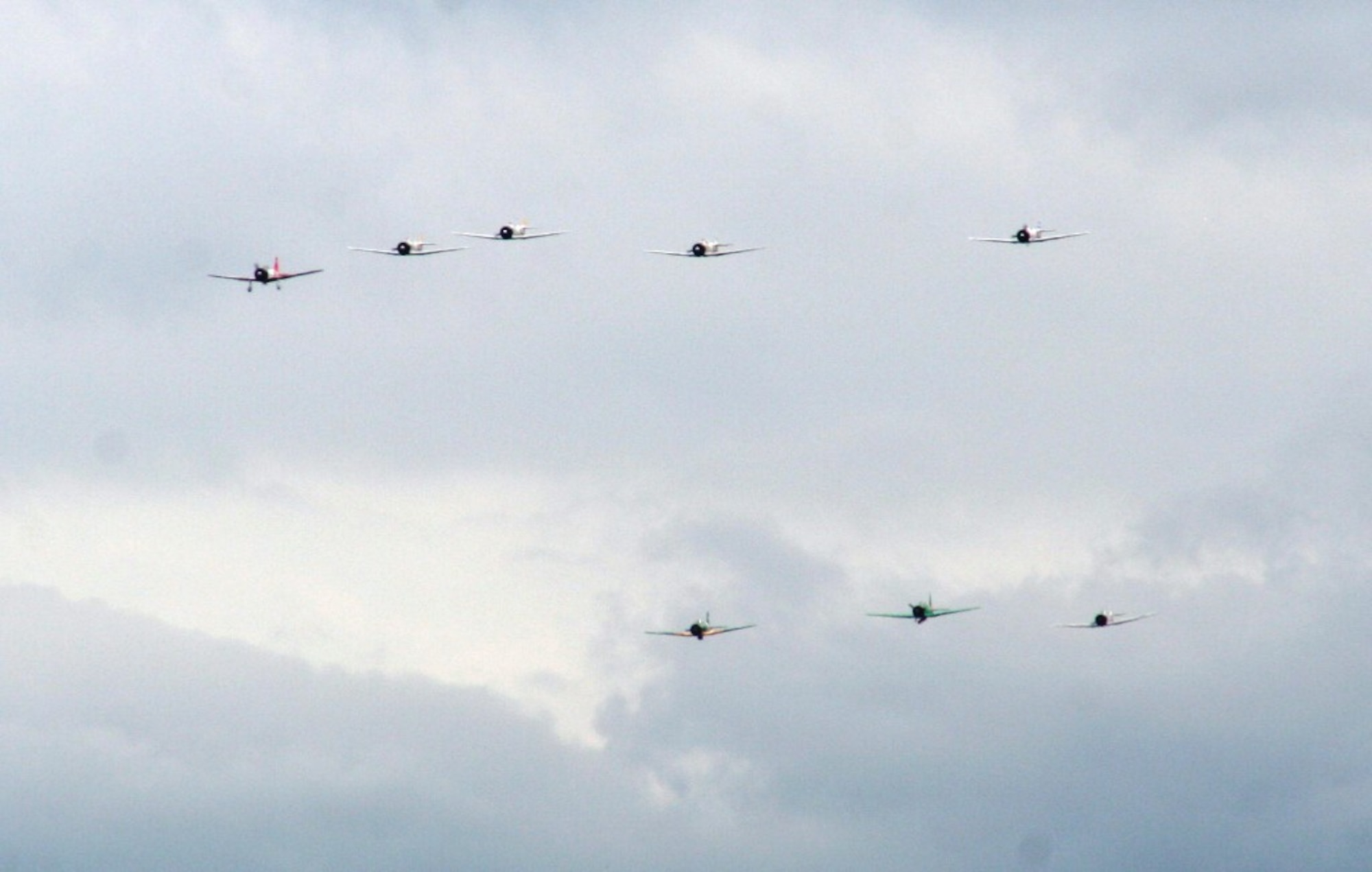 Vintage World War II-era aircraft flies through the air during the "Tora! Tora! Tora!" aerial demonstration by the Commemorative Air Force for the 2010 Airpower Over The Midwest Airshow on Sept. 11, 2010, at Scott Air Force Base, Ill. The demonstration re-enacts the Pearl Harbor attack. Tens of thousands of people attended the two-day airshow. (U.S. Air Force Photo/Master Sgt. Scott T. Sturkol)