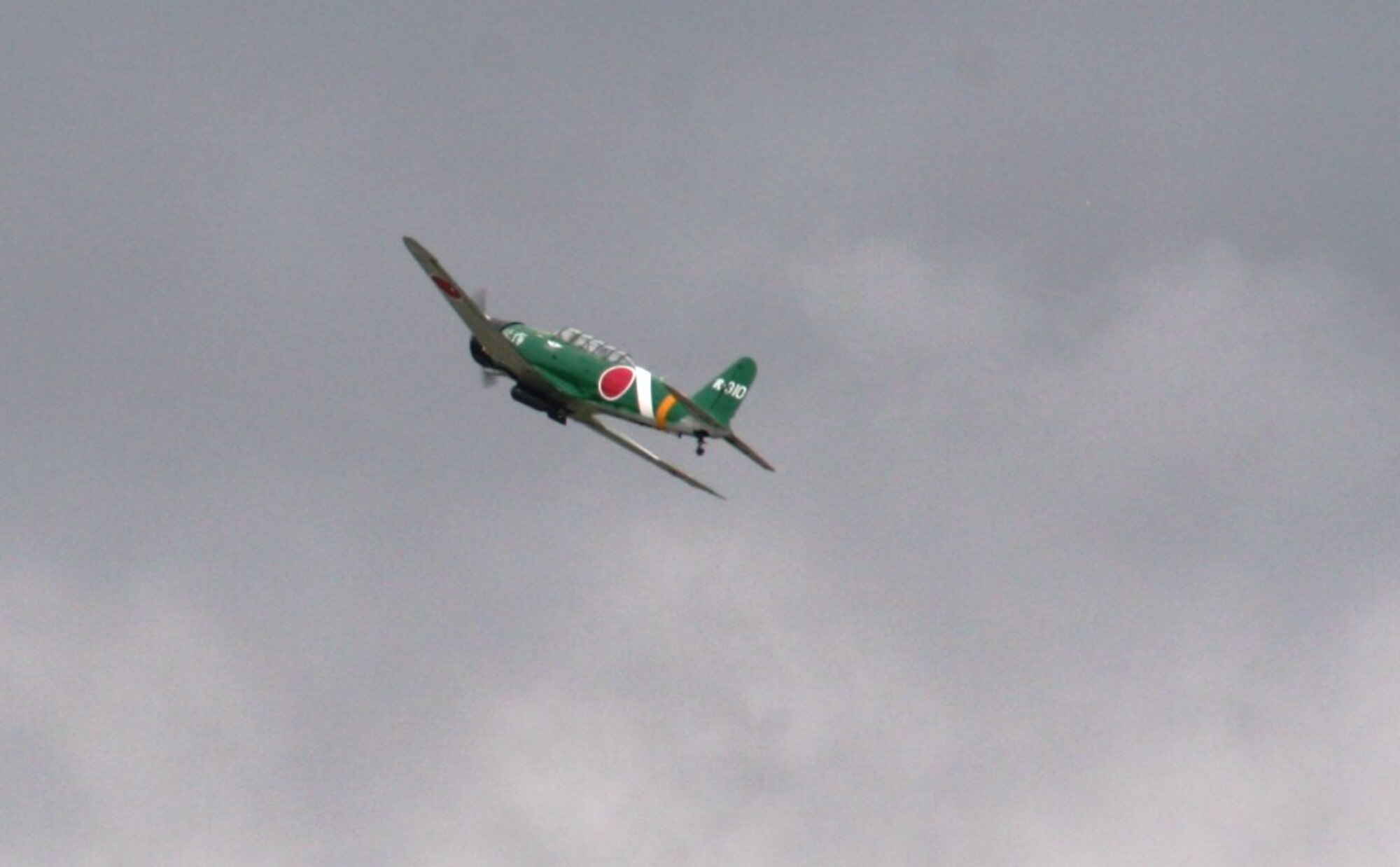 Vintage World War II-era aircraft flies through the air during the "Tora! Tora! Tora!" aerial demonstration by the Commemorative Air Force for the 2010 Airpower Over The Midwest Airshow on Sept. 11, 2010, at Scott Air Force Base, Ill. The demonstration re-enacts the Pearl Harbor attack. Tens of thousands of people attended the two-day airshow. (U.S. Air Force Photo/Master Sgt. Scott T. Sturkol)