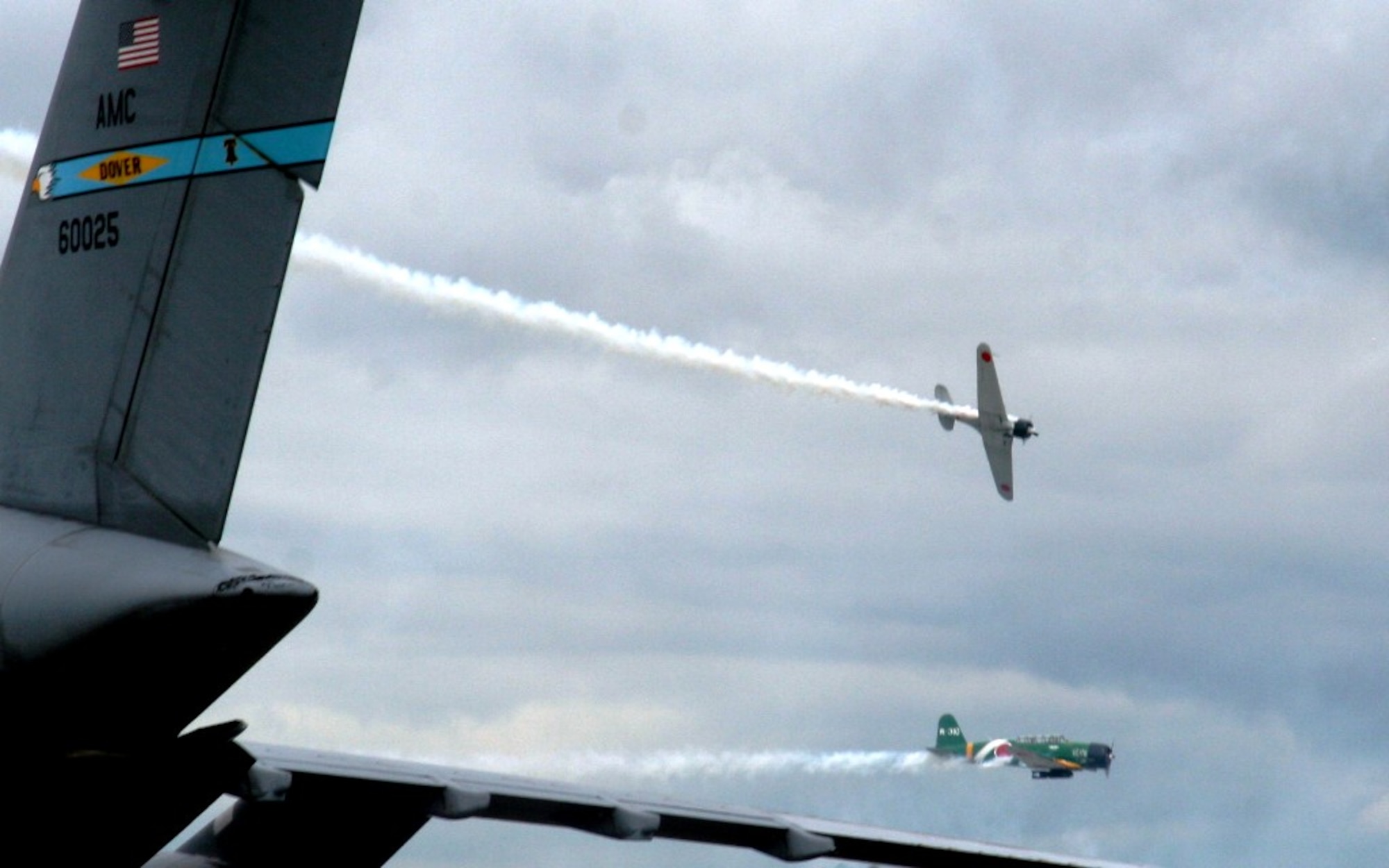Vintage World War II-era aircraft flies through the air during the "Tora! Tora! Tora!" aerial demonstration by the Commemorative Air Force for the 2010 Airpower Over The Midwest Airshow on Sept. 11, 2010, at Scott Air Force Base, Ill. The demonstration re-enacts the Pearl Harbor attack. Tens of thousands of people attended the two-day airshow. (U.S. Air Force Photo/Master Sgt. Scott T. Sturkol)