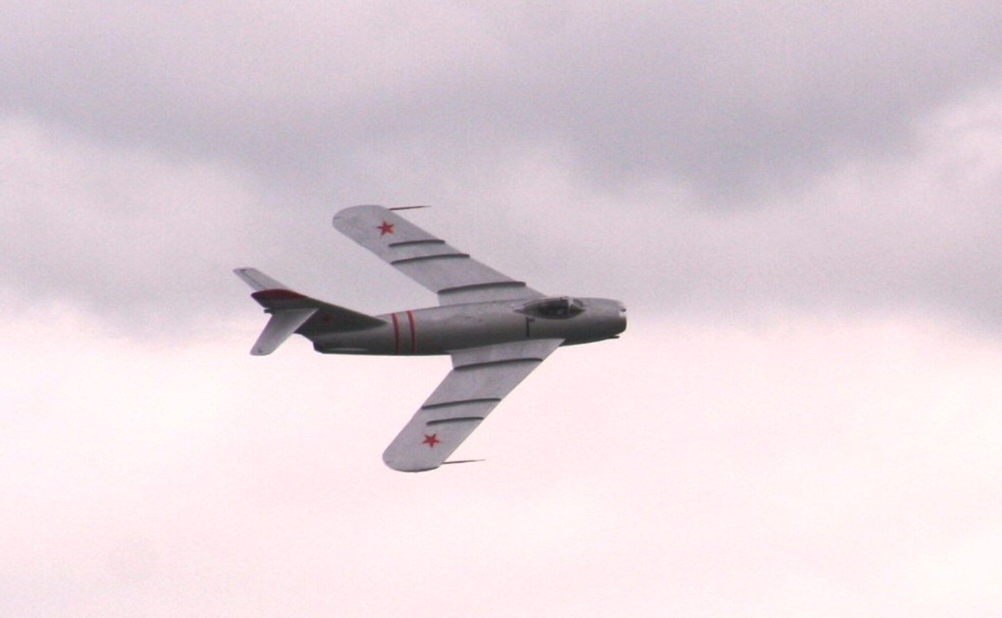A pilots guides a vintage Russian-built MiG 17 jet during an aerial demonstration for the 2010 Airpower Over The Midwest Airshow on Sept. 11, 2010, at Scott Air Force Base, Ill. Tens of thousands of people attended the two-day airshow. (U.S. Air Force Photo/Master Sgt. Scott T. Sturkol)