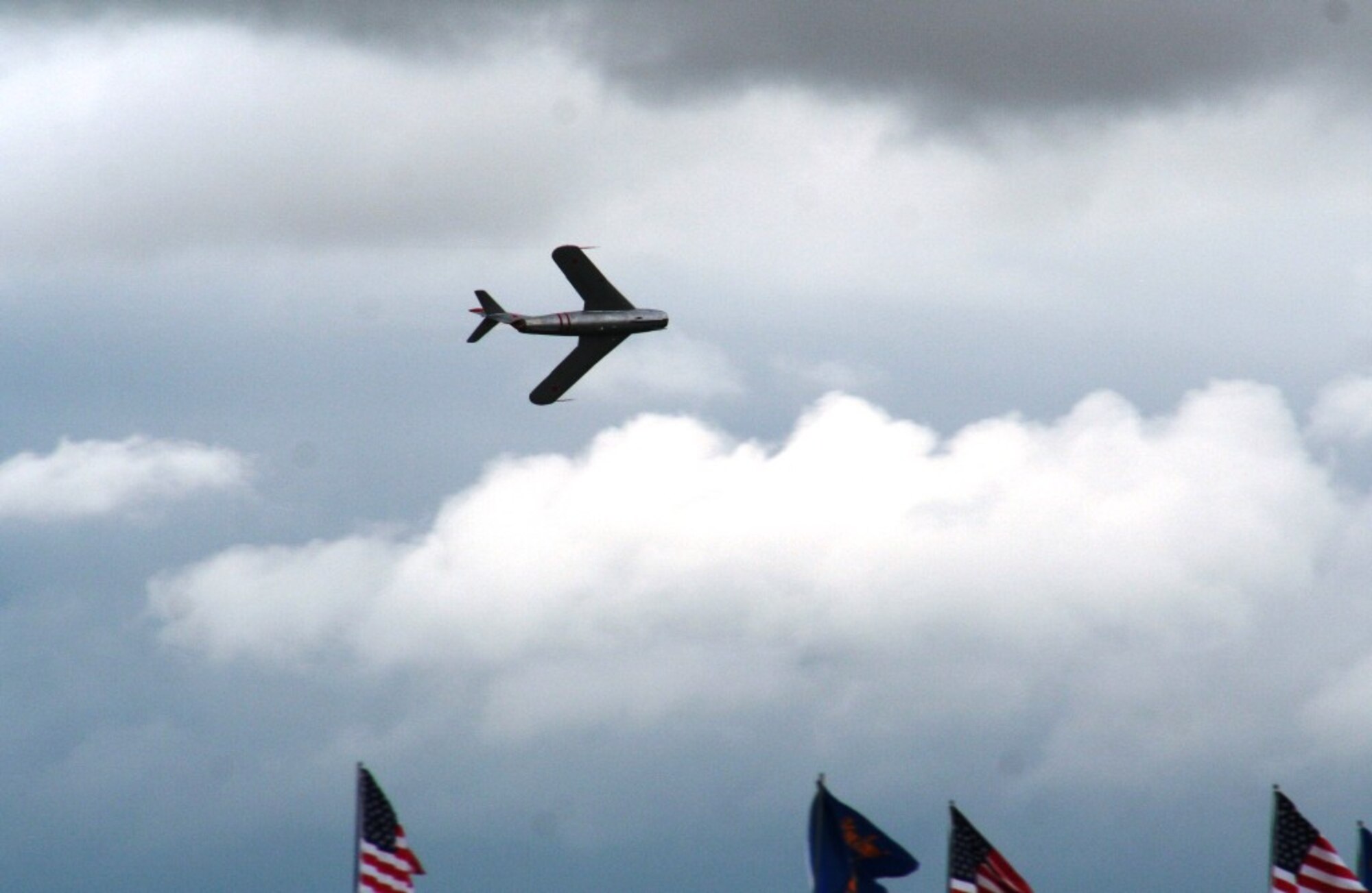 A pilots guides a vintage Russian-built MiG 17 jet during an aerial demonstration for the 2010 Airpower Over The Midwest Airshow on Sept. 11, 2010, at Scott Air Force Base, Ill. Tens of thousands of people attended the two-day airshow. (U.S. Air Force Photo/Master Sgt. Scott T. Sturkol)