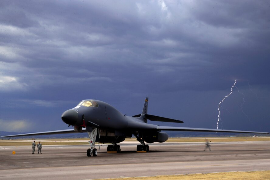 ELLSWORTH AIR FORCE BASE, S.D. – Lightning strikes behind a B-1B Lancer during an evening thunderstorm, Sept. 9. The 28th Bomb Wing maintains a fleet of 28 B-1s. (U.S. Air Force photo/Senior Airmen Corey Hook)