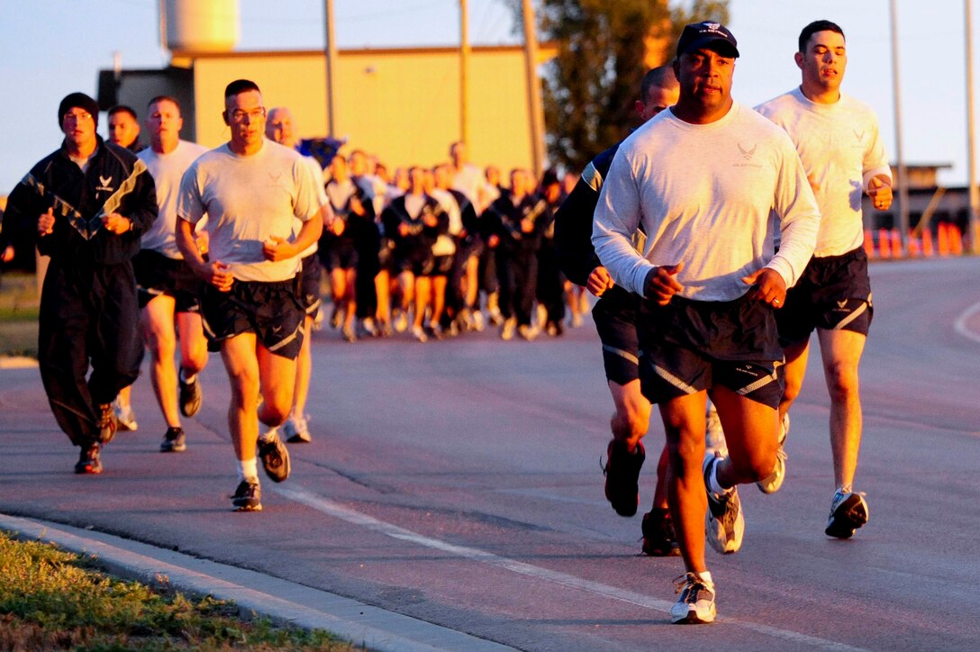 ELLSWORTH AIR FORCE BASE S.D. – (Front) Col. Trent Edwards, 28th Mission Support Group commander, runs in a 5k, Sept. 8. The 5k was mandatory for all Airmen assigned to the 28th Mission Support Squadron. (U.S. Air Force photo/Senior Airman Corey Hook)