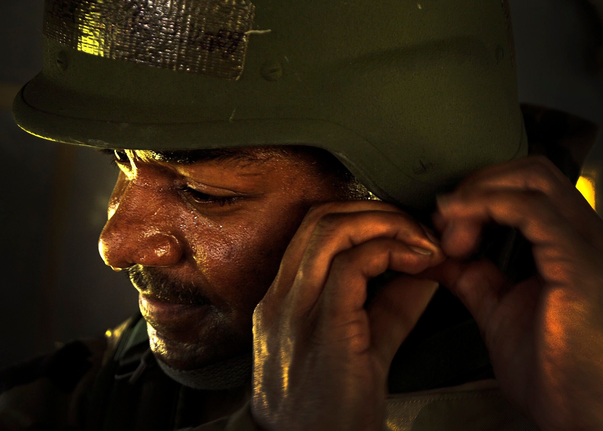 Master Sgt. Albert Anthony, 927th Air Refueling Wing, straps on his helmet during a training exercise at Camp Thunder, MacDill Air Force Base, Fla., Sept. 11, 2010. More than 300 Airmen from the 6th Air Mobility Wing and the 927th ARW participated in the training in preparation for the upcoming Operational Readiness Exercise. (U.S. Air Force photo by Staff Sgt. Angela Ruiz)