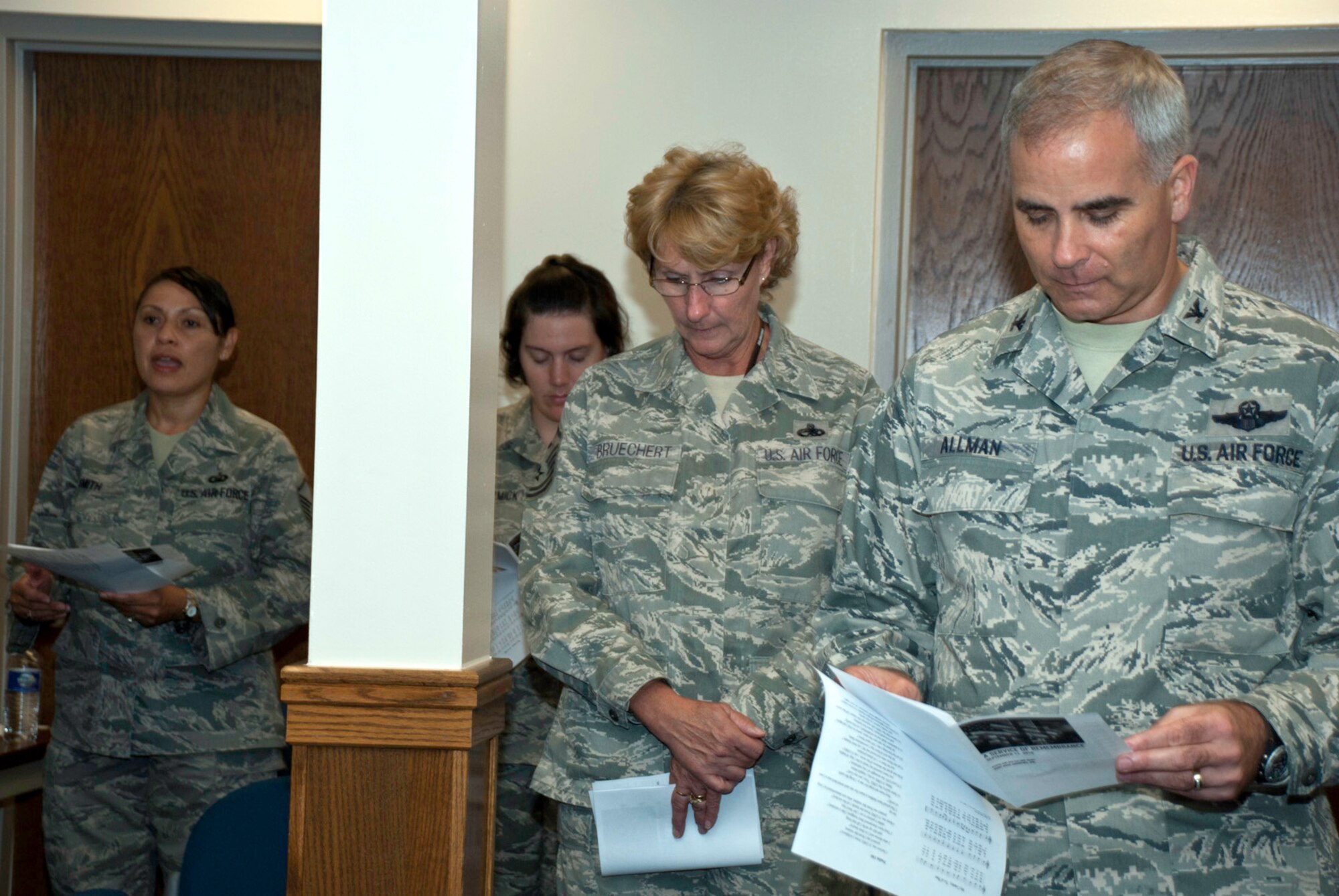 JOINT BASE ANDREWS --  Col. James M. Allman (far right), 459th Air Refueling Wing commander, and Master Sgt. Susan Bruechert (second from right), 459th Mission Support Squadron first sergeant, joined fellow 459th ARW Airmen in a 9/11 memorial service here. Moments of silence were also held throughout the day in remembrance of the victims lost during the terrorist attacks. (U.S. Air Force photo/Staff Sgt. Sophia Piellusch)