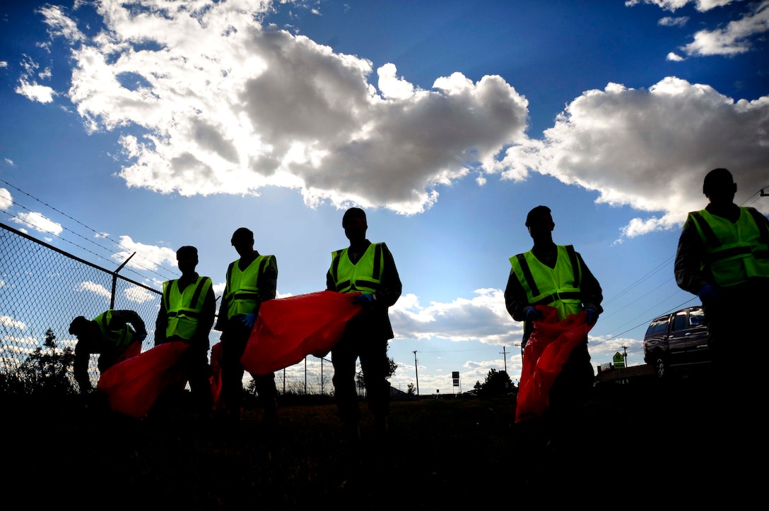 ELLSWORTH AIR FORCE BASE S.D. –Airmen of the 28th Security Forces Squadron logistics flight collect litter, Sept. 2. The logistics flight cares for the environment by volunteering time to pick up trash along their designated area every month. (U.S. Air Force photo/Senior Airman Corey Hook)