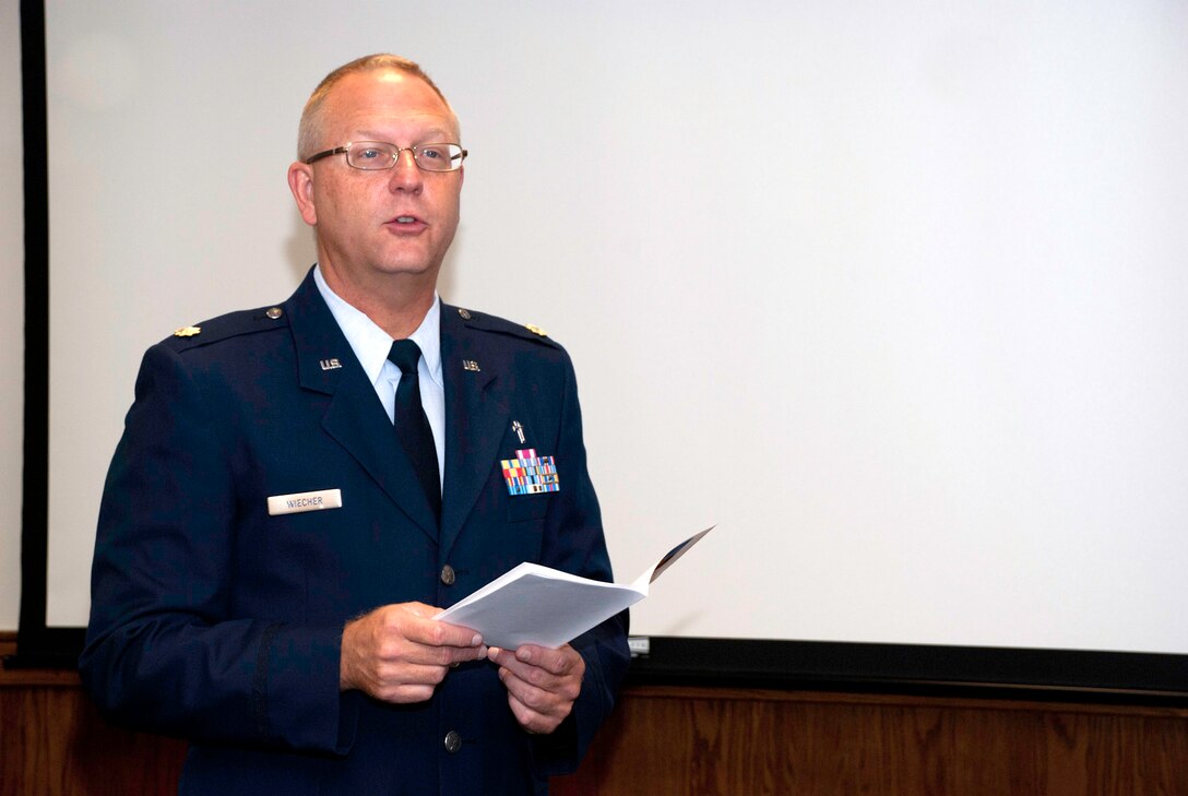 JOINT BASE ANDREWS, Md. -- 459th Air Refueling Wing Chaplain (Maj.) William Wiecher, gives a sermon to 459th ARW Airmen during a 9/11 memorial service here. Moments of silence were also held throughout the day in remembrance of the victims lost during the terrorist attacks. (U.S. Air Force photo/Staff Sgt. Sophia Piellusch)