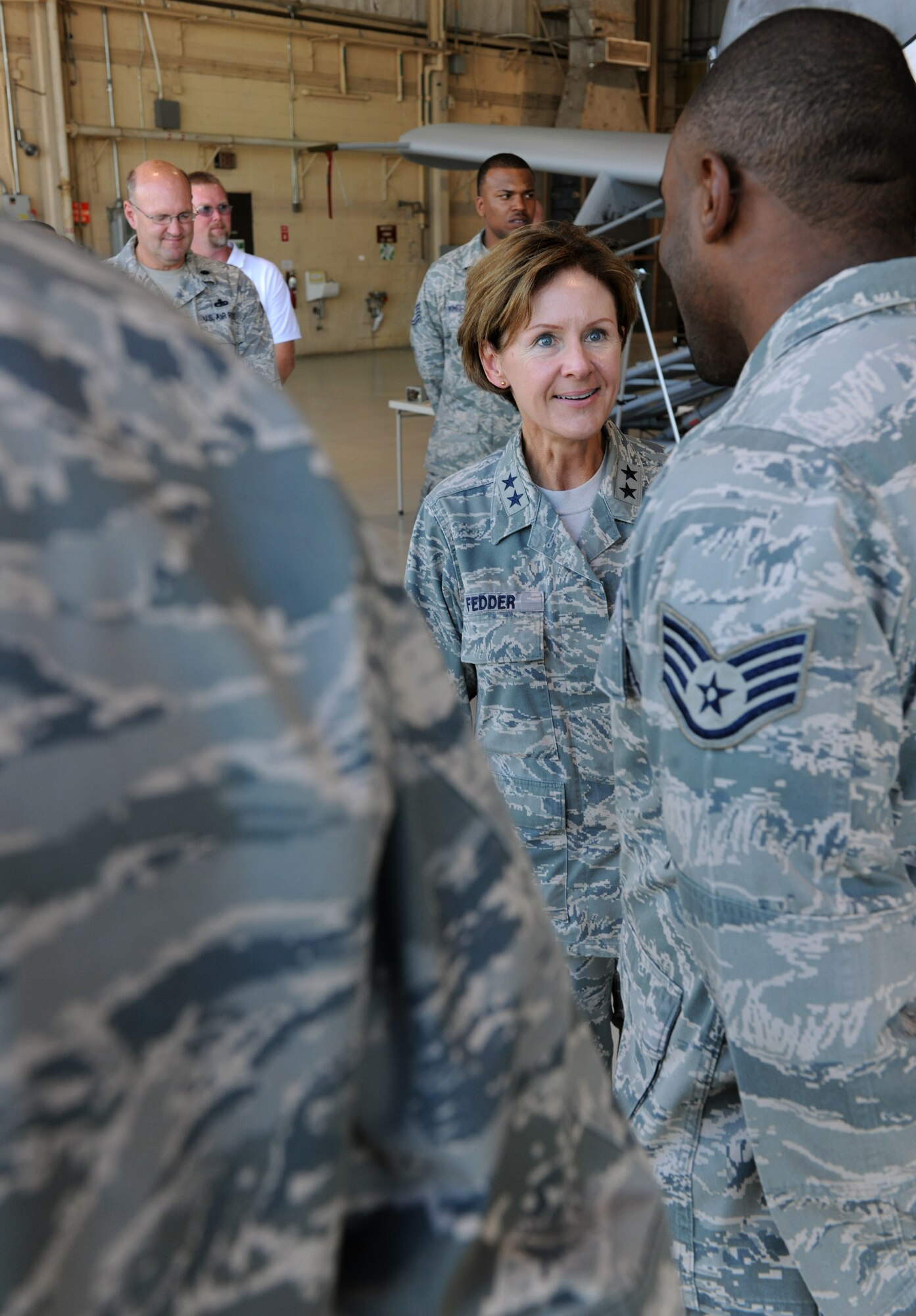 MOODY AIR FORCE BASE, Ga. -- Staff Sgt. Clint Williams, 23rd Maintenance Operations Squadron production manager, speaks about his recent success as a mixed martial arts fighter with Maj. Gen. Judith Fedder, Air Combat Command director of logistics, during her base visit here Sept. 9. Approximately 30 Airmen, like Sergeant Williams, were coined by the General for their hard work and outstanding performance. (U.S. Air Force photo/Airman 1st Class Benjamin Wiseman)
