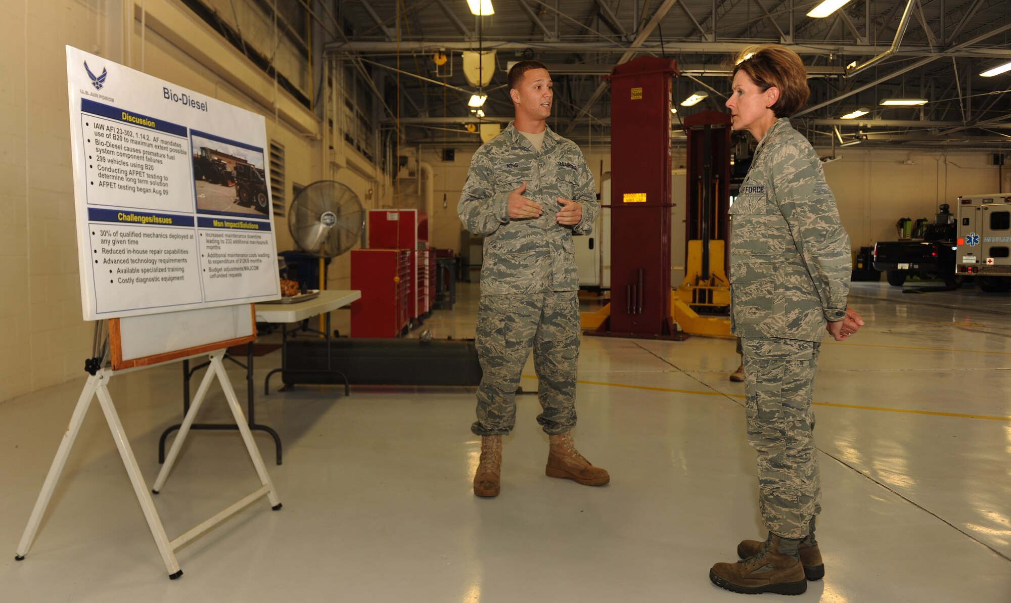 MOODY AIR FORCE BASE, Ga. -- Airman 1st Class Ryan King, 23rd Logistics Readiness Squadron vehicle equipment mechanic, explains the effects of biodiesel fuel when used by diesel-operated vehicles to Maj. Gen. Judith Fedder, Air Combat Command director of logistics, during her base visit here Sept. 9. General Fedder spent her day-long trip visiting many different logistics-related shops on base and being updated in new happenings. (U.S. Air Force photo/Airman 1st Class Benjamin Wiseman)
