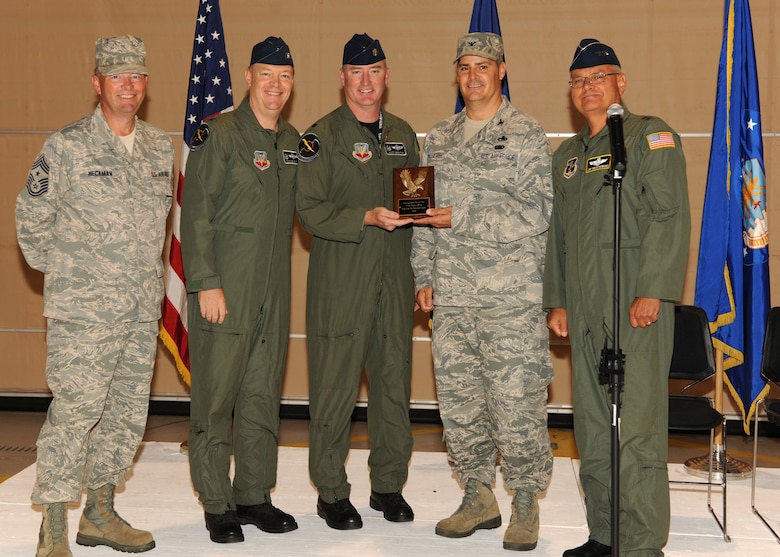 U.S. Air Force Col. John Balbierer, Commander of the 174th Fighter Wing (FW) Maintenance Group and Lt. Col. Scott Brenton, Vice Commander of the 174th FW Operations Group, receive the NGAUS distinguished flying plaque from Maj. Gen. James Kwiatkowski, Commander of the New York Air National Guard, Col Kevin Bradley, Commander of the 174th FW and Chief Master Sergeant David Heckman, 174th FW Command Chief at Hancock Field in Syracuse NY on 12 Sept 2010. The NGAUS plaque is to recognize outstanding Air National Guard flying units. (Photo by SSgt Ricky Best)