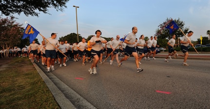 The whistle blows as runners take off at the beginning of the Commander's Fitness Challenge on Joint Base Charleston, S.C., Sept. 9, 2010. This month’s run was in remembrance of the Sept. 11, 2001 tragedies. Prior to the start of the run, Maj. Tara White, Force Support Squadron commander, urged runners to think about what this run should mean to them and to push their hardest. This month’s run also served as the Combined Federal Campaign kickoff. Each year, thousands of non-profit human health and welfare charities benefit from the millions of dollars that have been donated through CFC. (U.S. Air Force Photo/Airman 1st Class Lauren Main)
