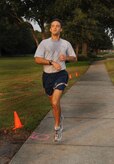 Capt. Josh Lundeby finishes first for the males with no other runners in sight at the Commander's Fitness Challenge held on Joint Base Charleston, S.C., Sept. 9, 2010. This month’s fitness challenge was held in remembrance of the Sept. 11, 2001 tragedies and was called "The Patriot Run". In addition, it also served as the Combined Federal Campaign kickoff. The CFC is the largest and most successful annual workplace charity campaign, with more than 300 CFC campaigns held worldwide to help raise millions of dollars each year. Capt. Lundeby finished the two-and-a-half-mile course in 14 minutes and 10 seconds. Capt. Lundeby is a C-17 pilot with the 17th Airlift Squadron. (U.S. Air Force Photo/Airman 1st Class Lauren Main)