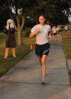 Capt. Michaela Judge sprints towards the finish line and finishes first for the females during the Commander's Fitness Challenge held on Joint Base Charleston, S.C., Sept. 9, 2010. This month’s fitness challenge was held in remembrance of the Sept. 11, 2001 tragedies and was called "The Patriot Run". In addition, it also served as the Combined Federal Campaign kickoff. The CFC is the largest and most successful annual workplace charity campaign, with more than 300 CFC campaigns held worldwide to help raise millions of dollars each year. Capt. Judge finished the two-and-a-half-mile course in 18 minutes and 38 seconds. Capt. Judge is the video flight commander with the 1st Combat Camera Squadron. (U.S. Air Force Photo/Airman 1st Class Lauren Main)