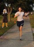Capt. Michaela Judge sprints towards the finish line during the Commander's Fitness Challenge held on Joint Base Charleston, S.C., Sept. 9, 2010. This month’s fitness challenge was held in remembrance of the Sept. 11, 2001 tragedies and was called "The Patriot Run". In addition, it also served as the Combined Federal Campaign kickoff. The CFC is the largest and most successful annual workplace charity campaign, with more than 300 CFC campaigns held worldwide to help raise millions of dollars each year. Capt. Judge finished the two-and-a-half-mile course in 18 minutes and 38 seconds. Capt. Judge is the video flight commander with the 1st Combat Camera Squadron. (U.S. Air Force Photo/Airman 1st Class Lauren Main)