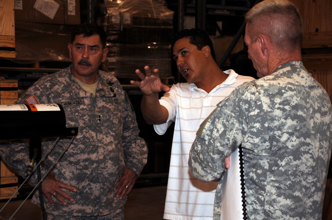 SOTO CANO AIR BASE, Honduras --  Mr. Victor Vega, the U.S. Army South equipment manager, center, briefs Maj. Gen. Simeon Trombitas, the USARSO commanding general, and Col. Gregory Reilly, the Joint Task Force-Bravo commander, about warehouse operations here Sept. 11. Before taking command of USARSO, General Trombitas was most recently the Special Assistant to the Commanding General, U.S. Army Special Operations Command in Fort Bragg, N.C. (U.S. Air Force photo/Tech. Sgt. Benjamin Rojek)