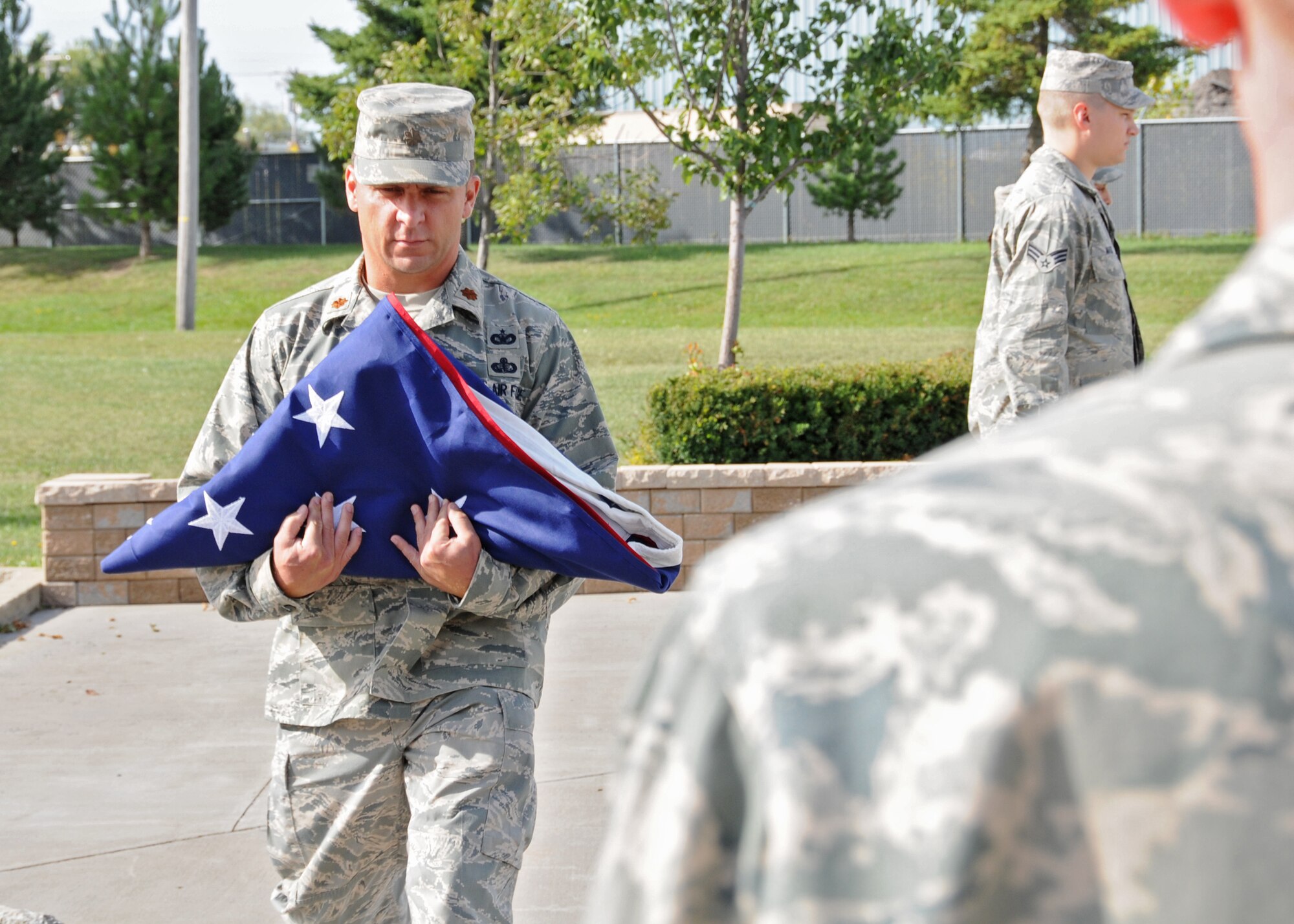 Members of the 914th Airlift Wing Services Prime Readiness in Base Services Squadron performed retreat on a very solemn and important anniversary in American History September 11, 2010 Niagara Falls Air Reserve Station, Niagara Falls, NY. (U.S. Air Force photo by Staff Sgt. Joseph McKee)