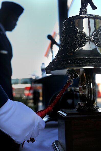 MOODY AIR FORCE BASE, Ga. -- Senior Airman Carlos Tirado, 23rd Civil Engineer Squadron firefighter, rings a fire bell symbolizing the last call for fallen firefighters during a 9/11 ceremony here Sept. 11. The annual ceremony honors the heroes who lost their lives during the events of Sept. 11, 2001. (U.S. Air Force photo/Airman 1st Class Joshua Green)
