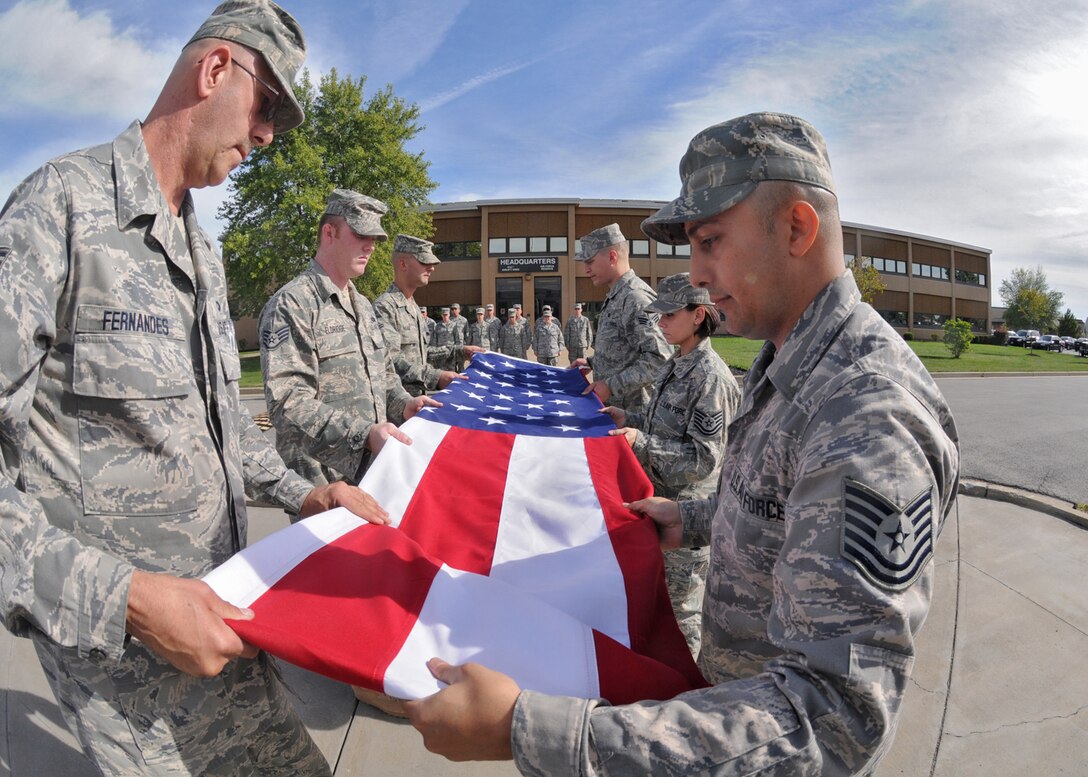 Members of the 914th Airlift Wing Services Prime Readiness in Base Services Squadron performed retreat on a very solemn and important anniversary in American History September 11, 2010 Niagara Falls Air Reserve Station, Niagara Falls, NY. (U.S. Air Force photo by Staff Sgt. Joseph McKee)