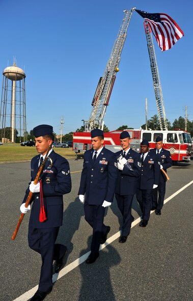 MOODY AIR FORCE BASE, Ga. -- Firefighters from the 23rd Civil Engineer Squadron practice walking along a white line before the start of a 9/11 ceremony here Sept. 11. The Airmen will present the flag at half-staff during the ceremony. (U.S. Air Force photo/Airman 1st Class Joshua Green)
