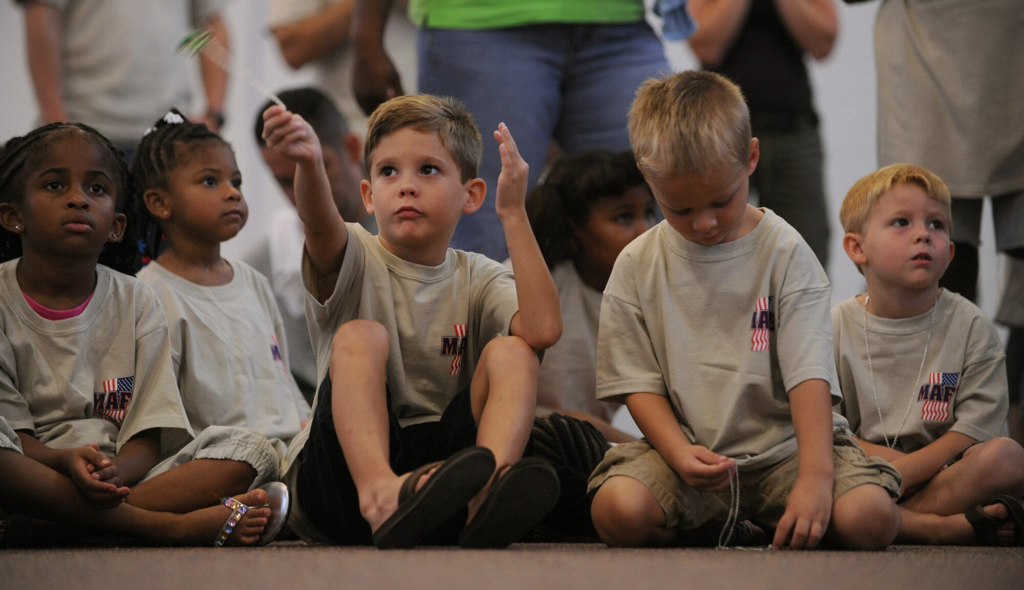 MOODY AIR FORCE BASE, Ga. -- Children attending the Kids Deployment Line prepare to split up into flights as guest speakers give the initial briefings here Sept. 11. Approximately 130 Moody youth members attended the Kids Deployment Line event. (U.S. Air Force photo/Airman 1st Class Benjamin Wiseman)
