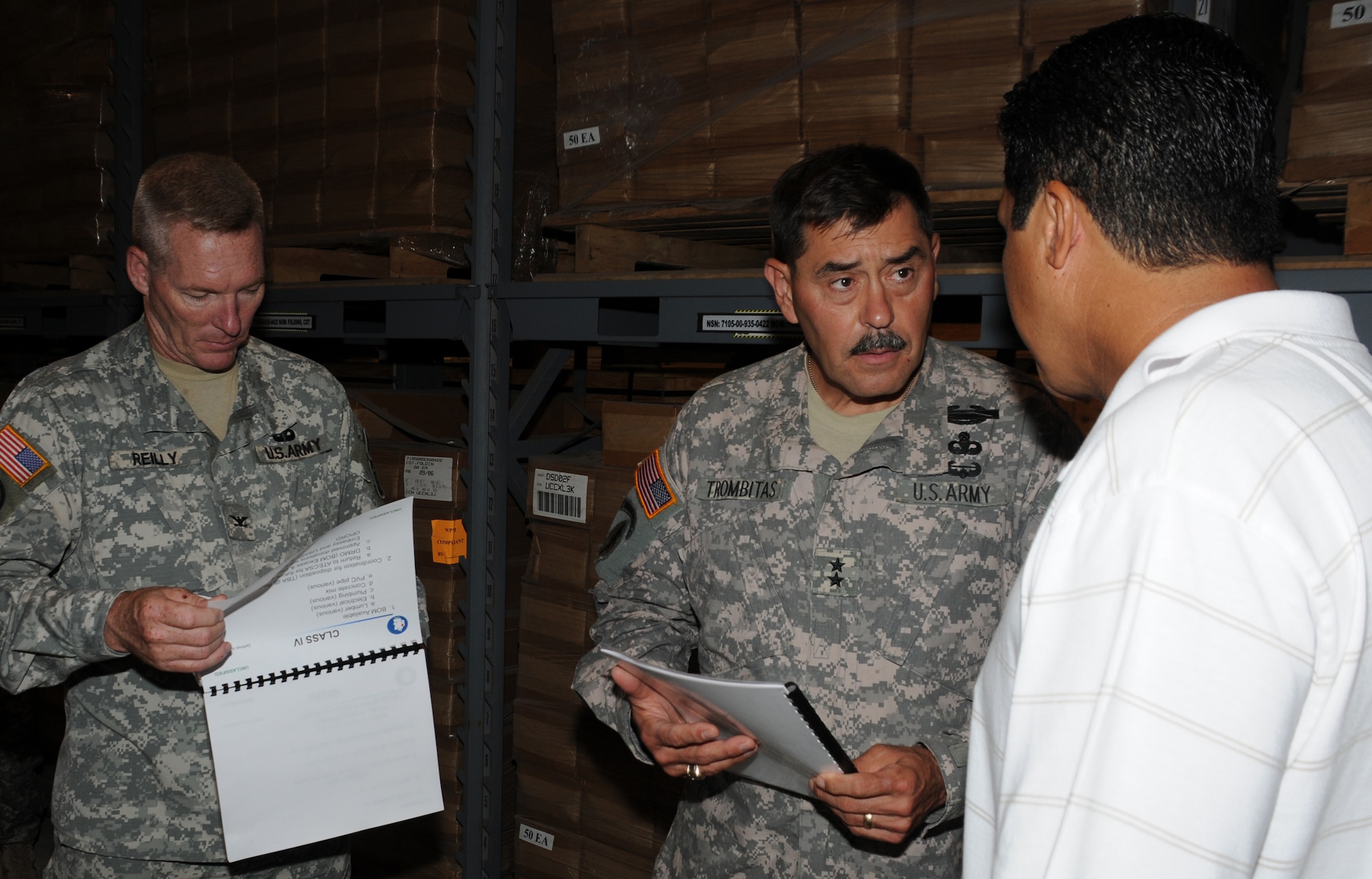 SOTO CANO AIR BASE, Honduras --  Col. Gregory Reilly, the Joint Task Force-Bravo commander, left, and Maj. Gen. Simeon Trombitas receive a mission briefing from Mr. Victor Vega, the U.S. Army South equipment manager, here Sept. 11. General Trombitas took command of USARSO on Nov. 9, 2009. (U.S. Air Force photo/Tech. Sgt. Benjamin Rojek)