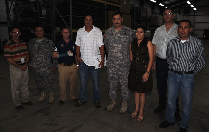 SOTO CANO AIR BASE, Honduras --  Maj. Gen. Simeon Trombitas, the U.S. Army South commanding general, fourth from the right, poses with Joint Task Force-Bravo's J4 personnel during a visit here Sept. 11. During his visit, General Trombitas and Command Sgt. Maj. Gabriel Cervantes, the command sergeant major for USARSO, saw first-hand the mission of JTF-Bravo. (U.S. Air Force photo/Tech. Sgt. Benjamin Rojek)