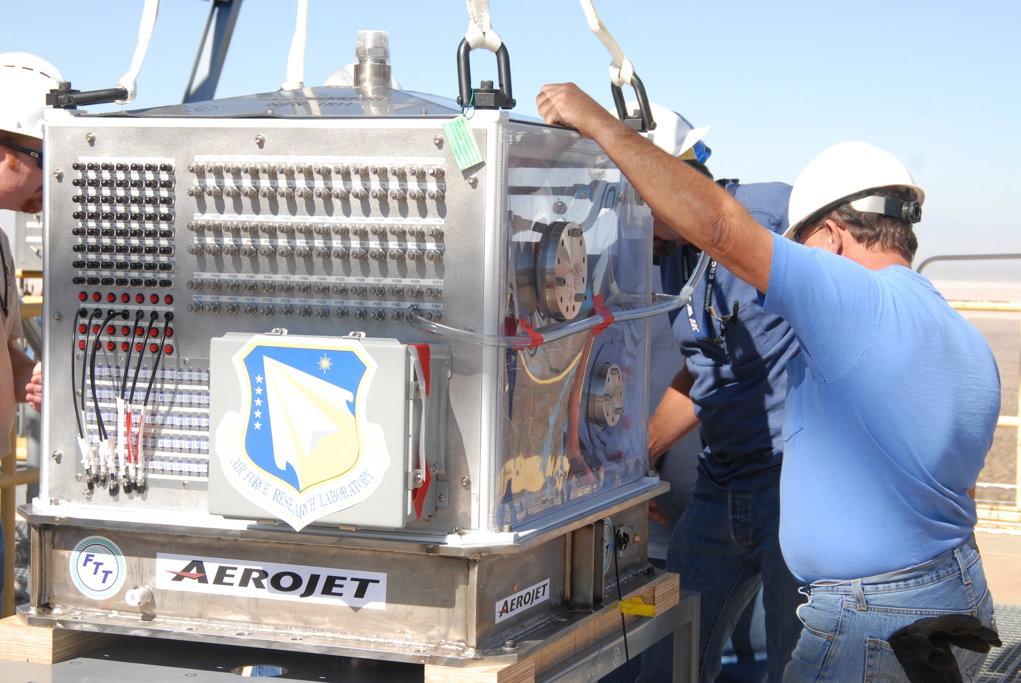 The USET turbo pump sits in a "test skid" containter, which has more than 135 connectors that will be used to collect data once testing is started.  Liquid hydrogen will be fed through the pump to see how it performs once attached to the test stand.  (Air Force photo by Kenji Thuloweit)