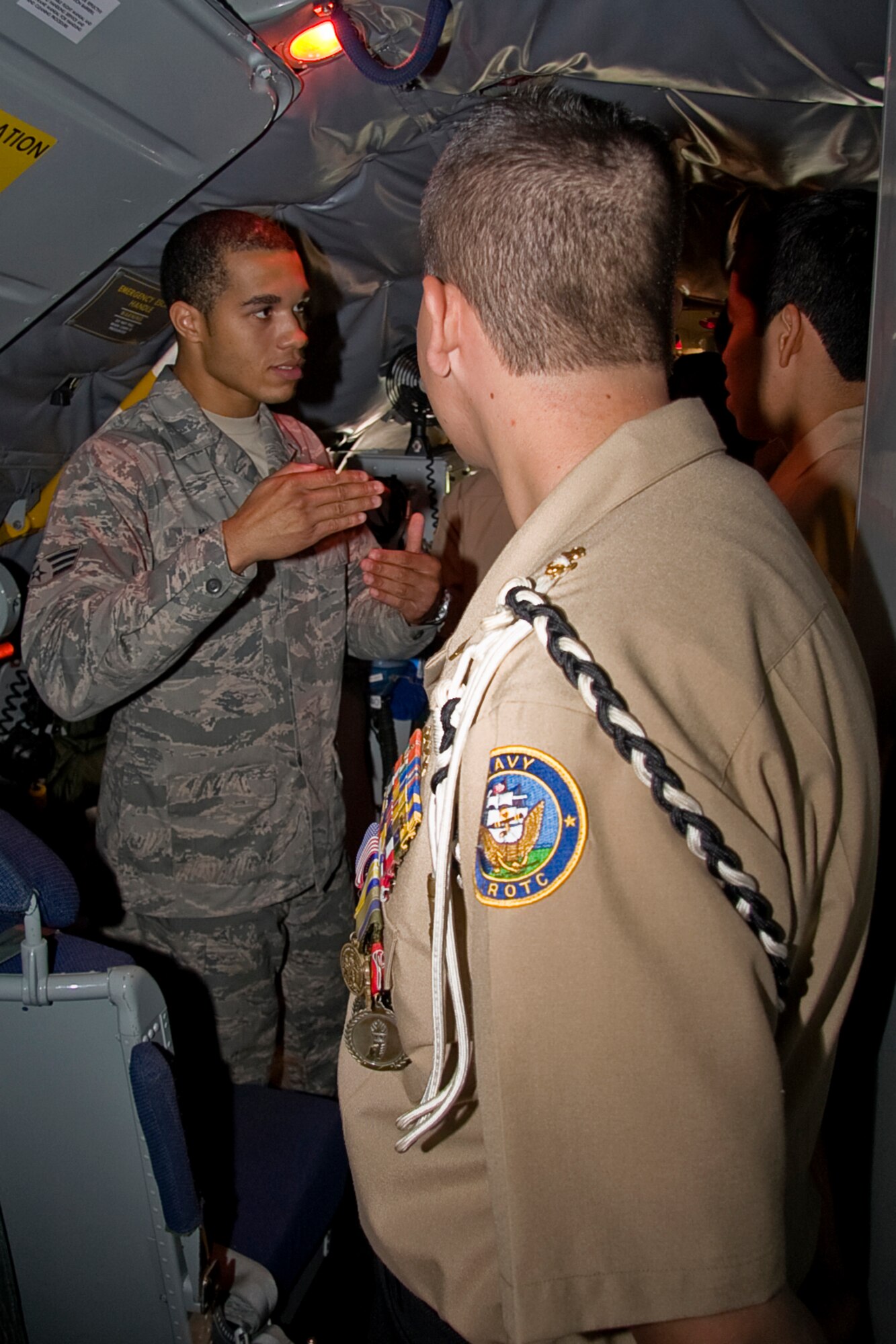 GRISSOM AIR RESERVE BASE, Ind. -- Standing in the cockpit of a KC-135R Stratotanker, Senior Airman Cory King discusses the mechanics of the aircraft with Navy Junior Reserve Officers Training Corps cadets Sept. 8. The NJROTC cadets from Proviso East High School in Maywood, Ill., visited Grissom to gain a better understanding of military operations and life. Airman King is an aircraft electrical and environmental specialist with the 434th Aircraft Maintenance Squadron.  (U.S. Air Force photo/Tech. Sgt. Mark R. W. Orders-Woempner)