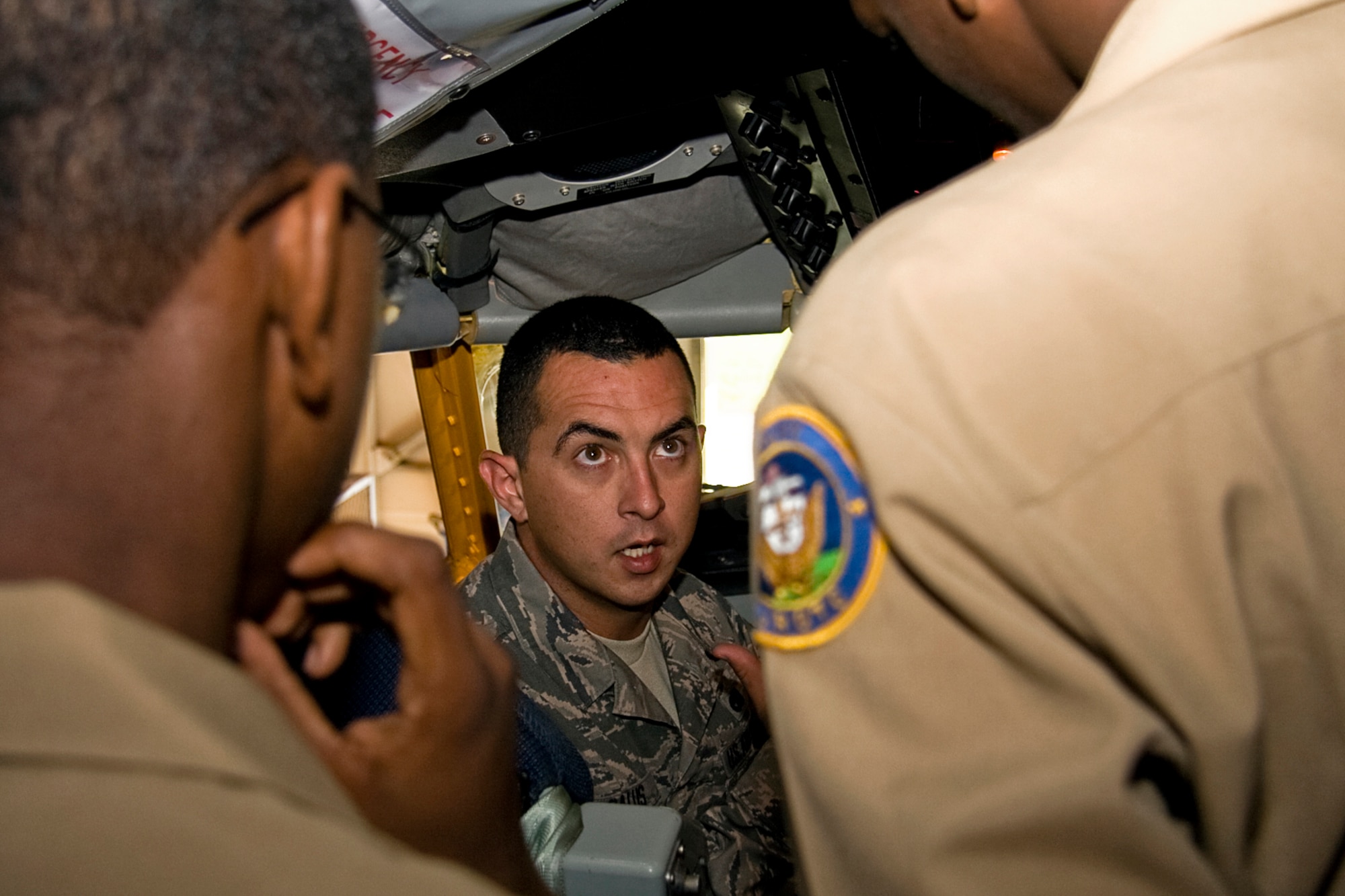 GRISSOM AIR RESERVE BASE, Ind. -- Sitting in the cockpit of a KC-135R Stratotanker, Senior Airman Brandon Galus, a KC-135R crew chief with the 434th Aircraft Maintenance Squadron, answers a question about the aircraft from Navy Junior Reserve Officers Training Corps cadets Sept. 8. The cadets, from Proviso East High School in Maywood, Ill., toured Grissom, visiting both the Marine Corps Reserve detachment here and a KC-135. The mission of the NJROTC program is to instill in students in United States secondary educational institutions the values of citizenship, service to the United States, personal responsibility and a sense of accomplishment. (U.S. Air Force photo/Tech. Sgt. Mark R. W. Orders-Woempner)