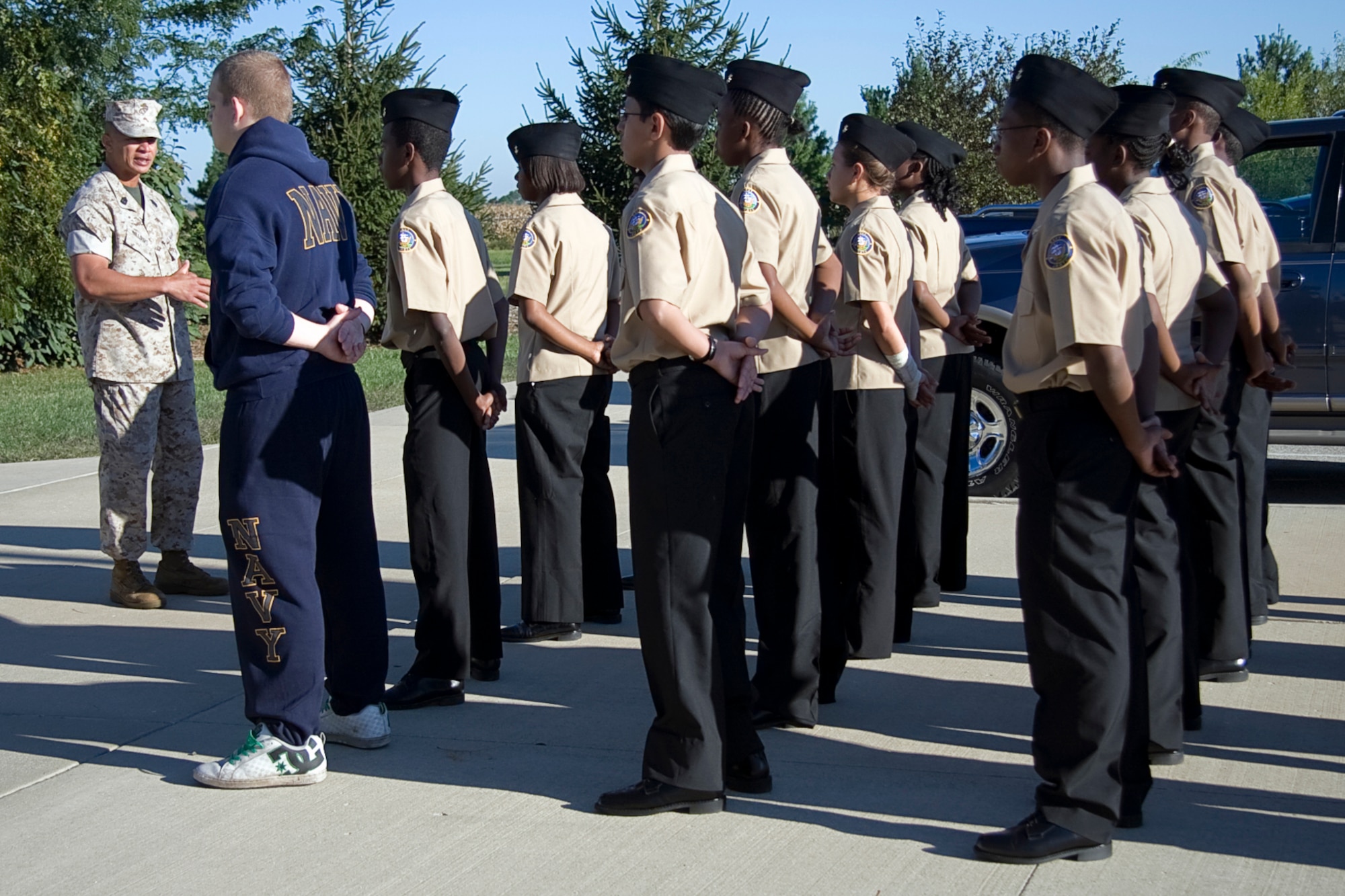 GRISSOM AIR RESERVE BASE, Ind. -- U.S. Marine Corps 1st Sgt. Ronnie Williams welcomes a group of Navy Junior Reserve Officers Training Corps cadets to the Marine Corps Reserve detachment here Sept. 8. The cadets visited Grissom as part of a tour where they were able to talk with Marines from Detachment 1, Communications Company, Headquarters and Service Battalion, 4th Marine Logistics Group. They also were able to climb onboard one of Grissom?s KC-135R Stratotanker aircraft and talk with maintenance Airmen. (U.S. Air Force photo/Tech. Sgt. Mark R. W. Orders-Woempner)