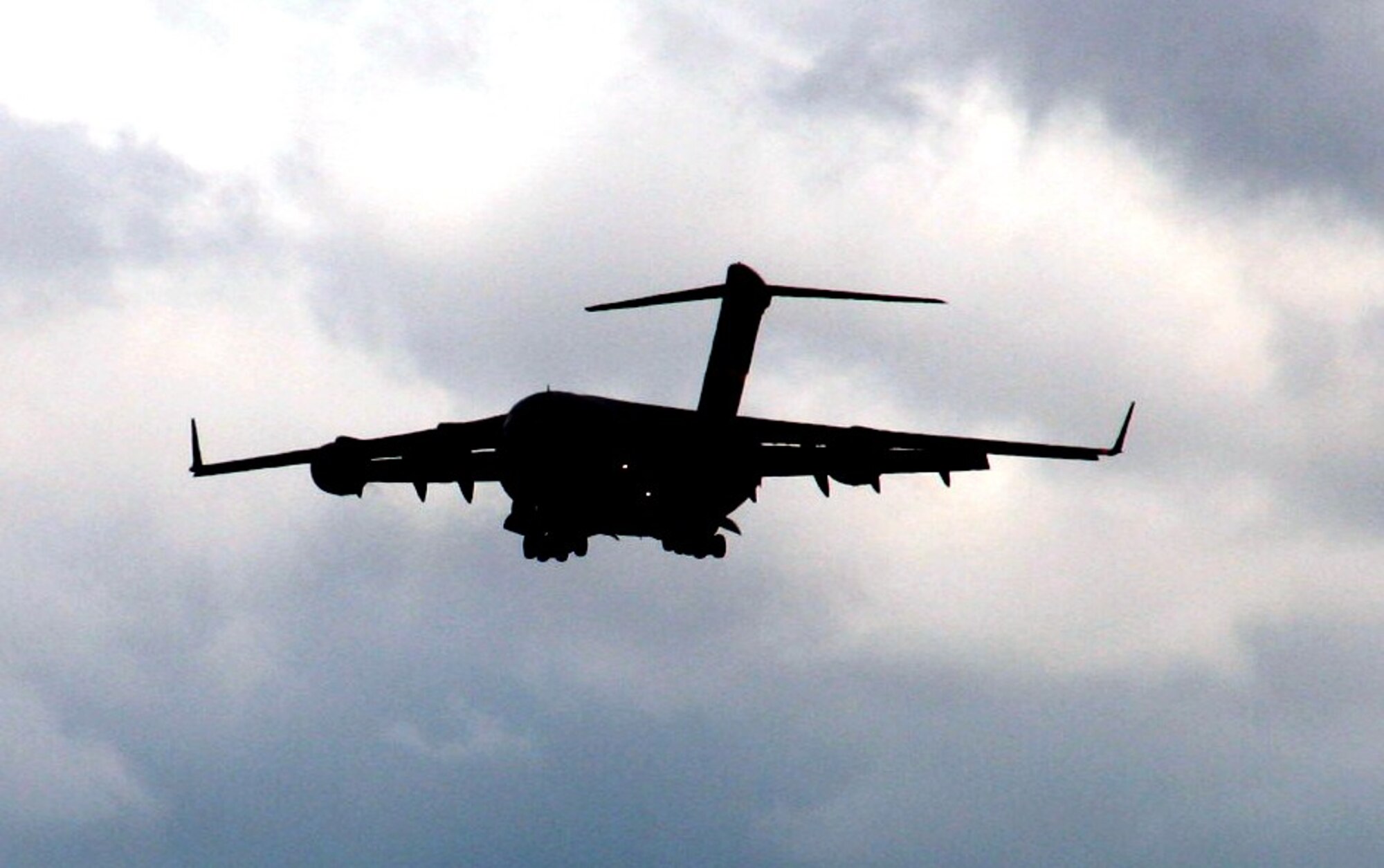 A C-17 Globemaster III crew from the 97th Air Mobility Wing at Altus Air Force Base, Okla., flies a C-17 over Scott AFB, Ill., on Sept. 11, 2010. The C-17 and the Airmen who fly and maintain it were on hand to hold an aerial demonstration for the 2010 Airpower Over The Midwest Airshow at Scott AFB. During the two-day airshow, tens of thousands of people attended. The C-17 is the Air Force's and Air Mobility Command's newest airlift aircraft. (U.S. Air Force Photo/Master Sgt. Scott T. Sturkol)