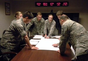 LANGLEY AIR FORCE BASE, Va. -- Airmen from the 15th Intelligence Squadron participate in the first "Iron Catalyst" exercise Aug. 6. The scenario involved three fictional countries, encompassing events such as humanitarian crises, civil war and acts of terrorism. (U.S. Air Force photo/Airman 1st Class Jesse Sluss)