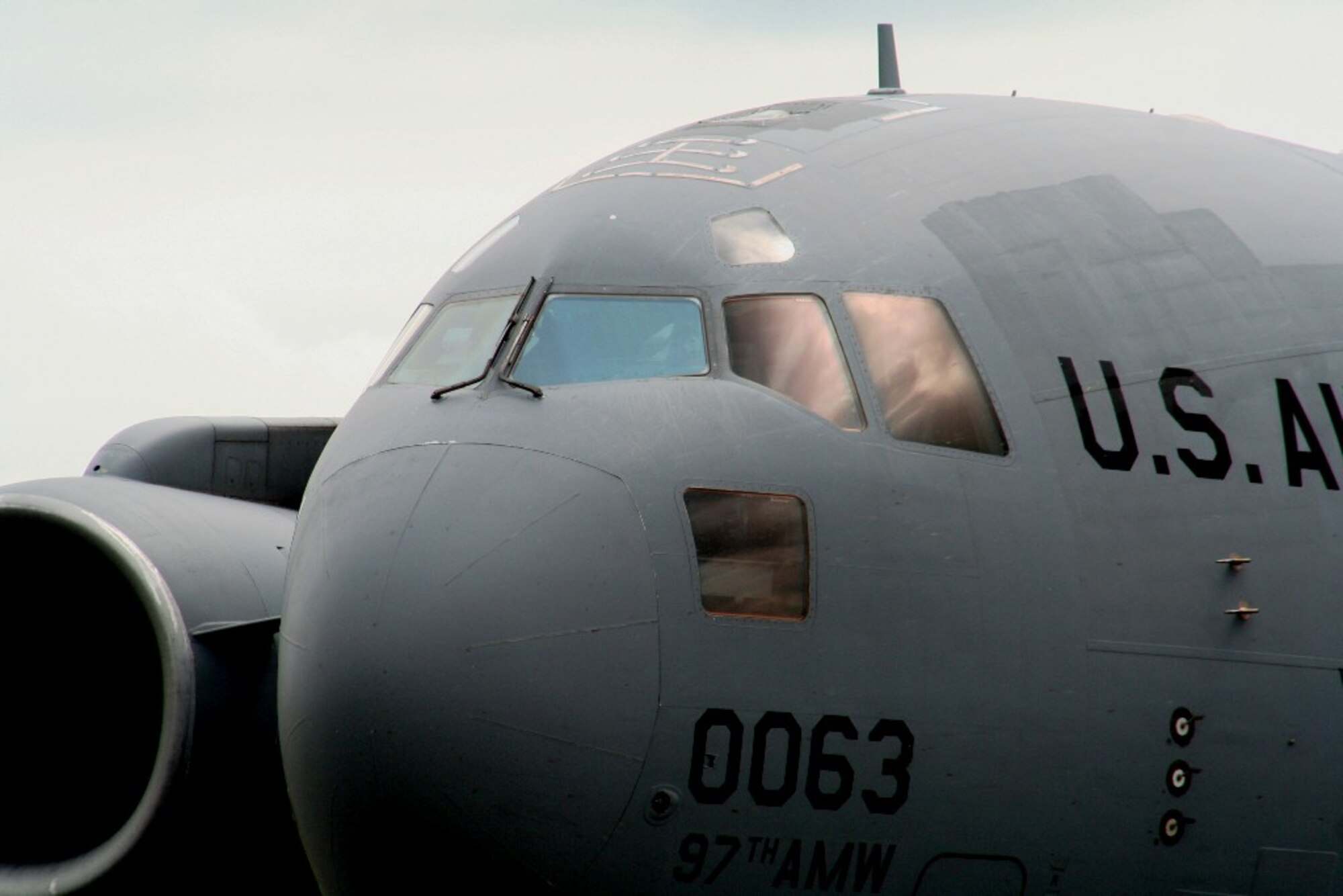 A C-17 Globemaster III from the 97th Air Mobility Wing at Altus Air Force Base, Okla., is parked on the flightline at Scott AFB, Ill., on Sept. 11, 2010. The C-17 and the Airmen who fly and maintain it were on hand to hold an aerial demonstration for the 2010 Airpower Over The Midwest Airshow at Scott AFB. During the two-day airshow, tens of thousands of people attended. The C-17 is the Air Force's and Air Mobility Command's newest airlift aircraft. (U.S. Air Force Photo/Master Sgt. Scott T. Sturkol)