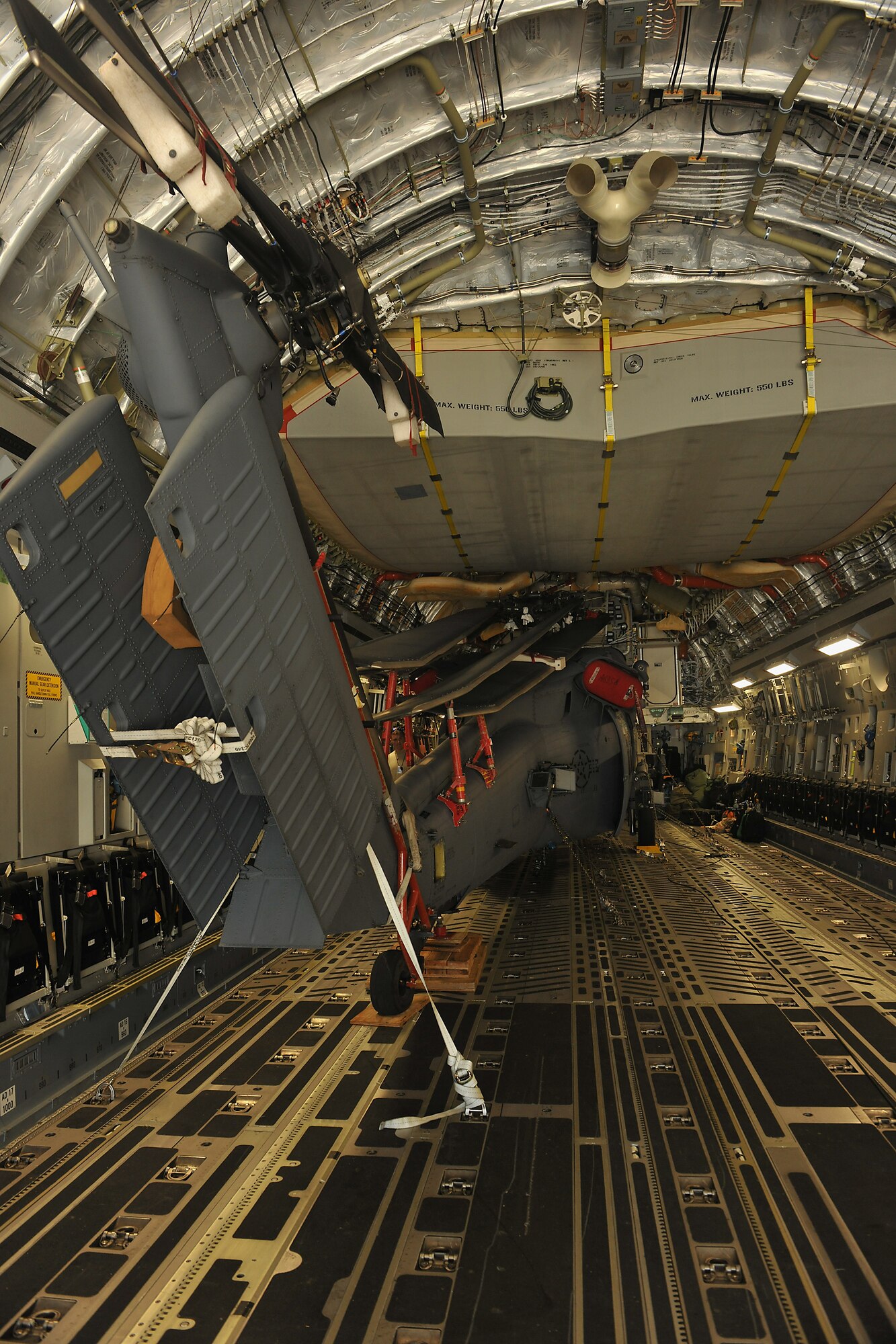 MOODY AIR FORCE BASE, Ga. -- An HH-60G Pave Hawk from the 41st Rescue Squadron is placed in the back of a C-17 Globemaster III from Dover Air Force Base, Del., here Sept. 3. The aircraft will be sent to an overseas location to support a 41st RQS deployment. (U.S. Air Force photo/Airman 1st Class Joshua Green)

