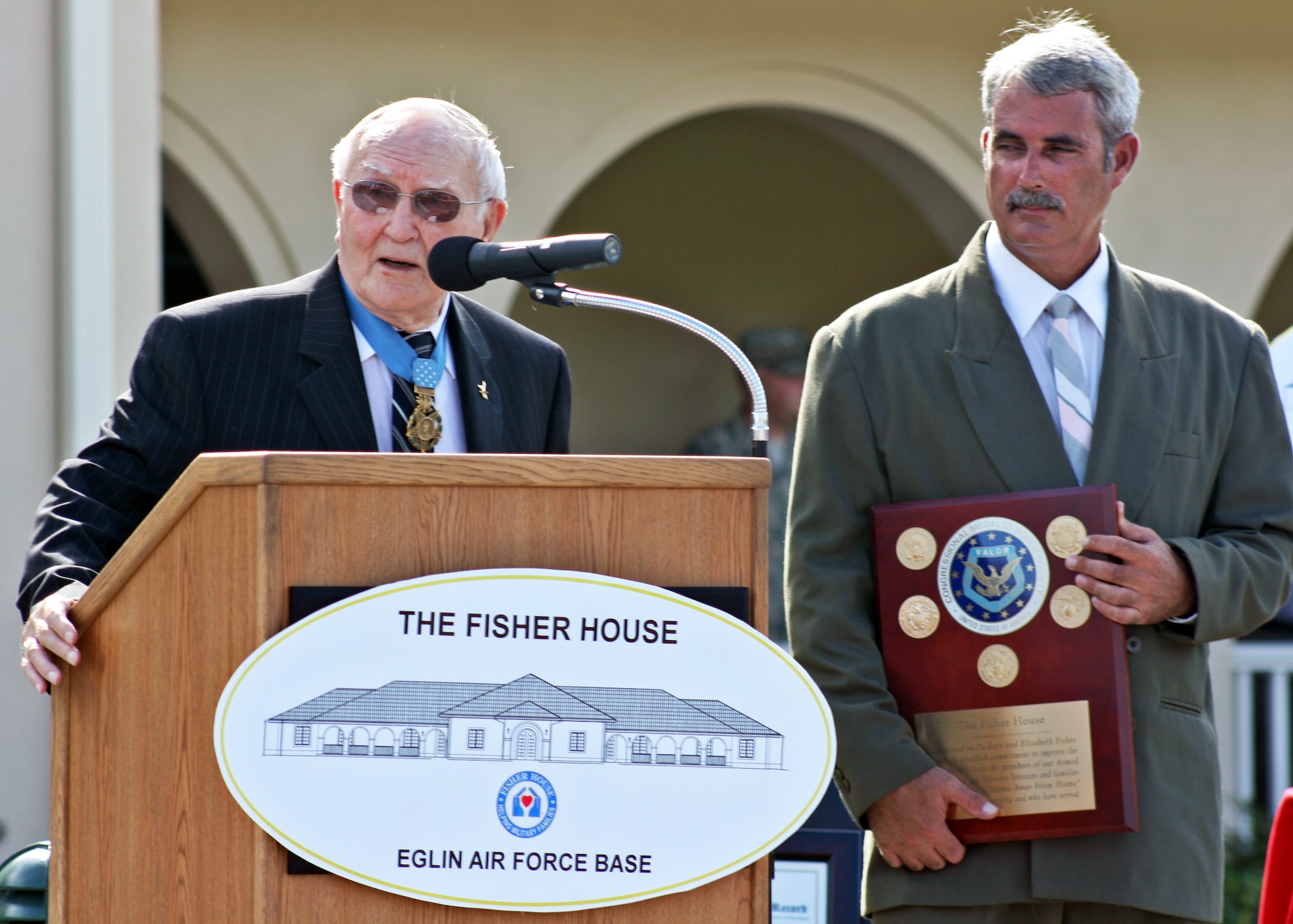 Col. (ret.) George E. "Bud" Day speaks at the Fisher House ribbon cutting Sept. 10 at Eglin Air Force Base, Fla.  The new facility provides free lodging to veterans and military families receiving treatment at the base hospital or veteran's center.  (U.S. Air Force photo/2nd Lt. Andrew Caulk.)