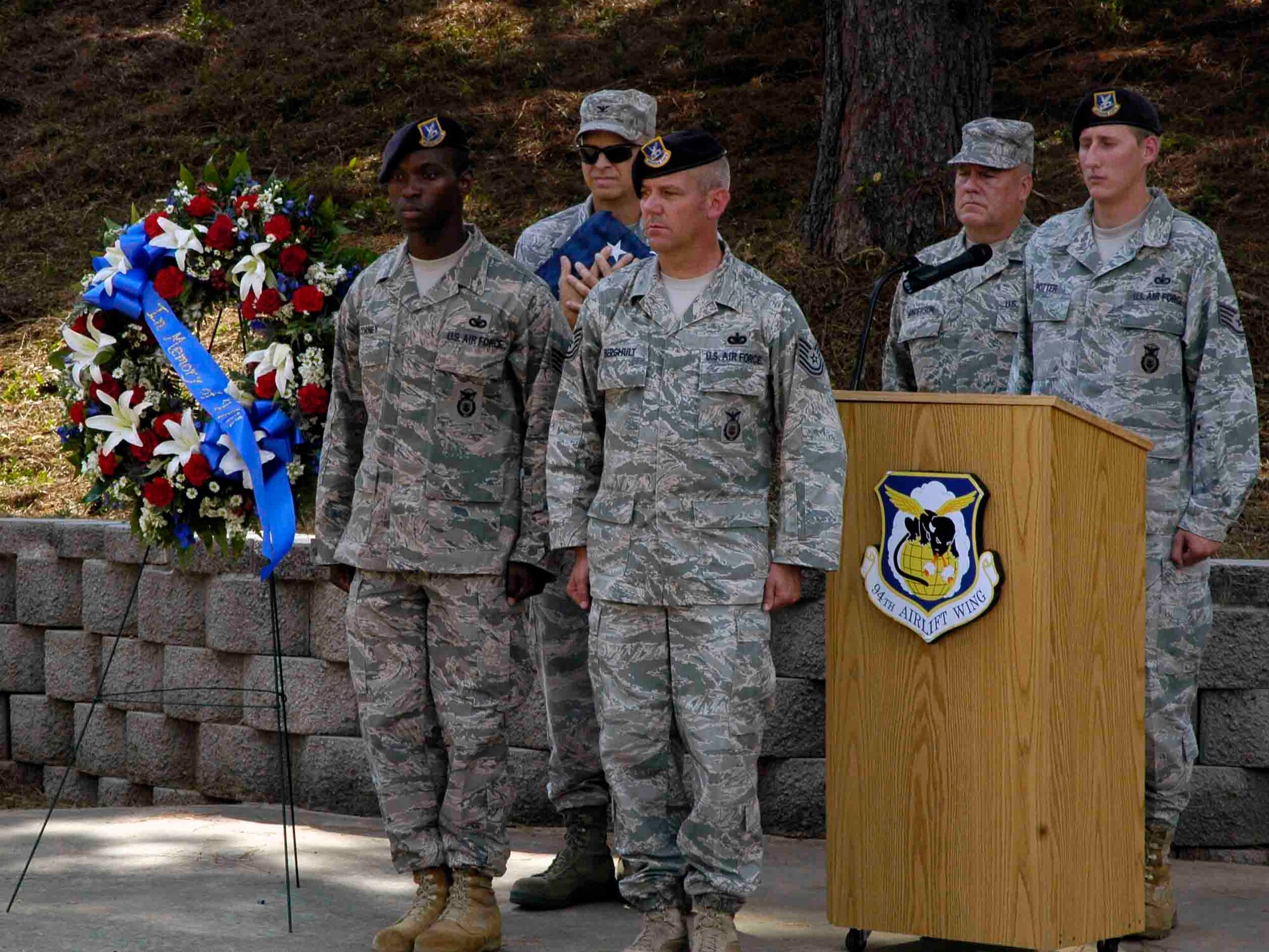 Dobbin’s servicemembers participated in a memorial and retreat ceremony in the POW/MIA Memorial Park here marking the Sept. 11 2001 anniversary. A wreath was presented in honor of the victims.  Afterward the American flag was lowered and symbolically folded. (U.S. Air Force photo/ Senior Airman Danielle Campbell)