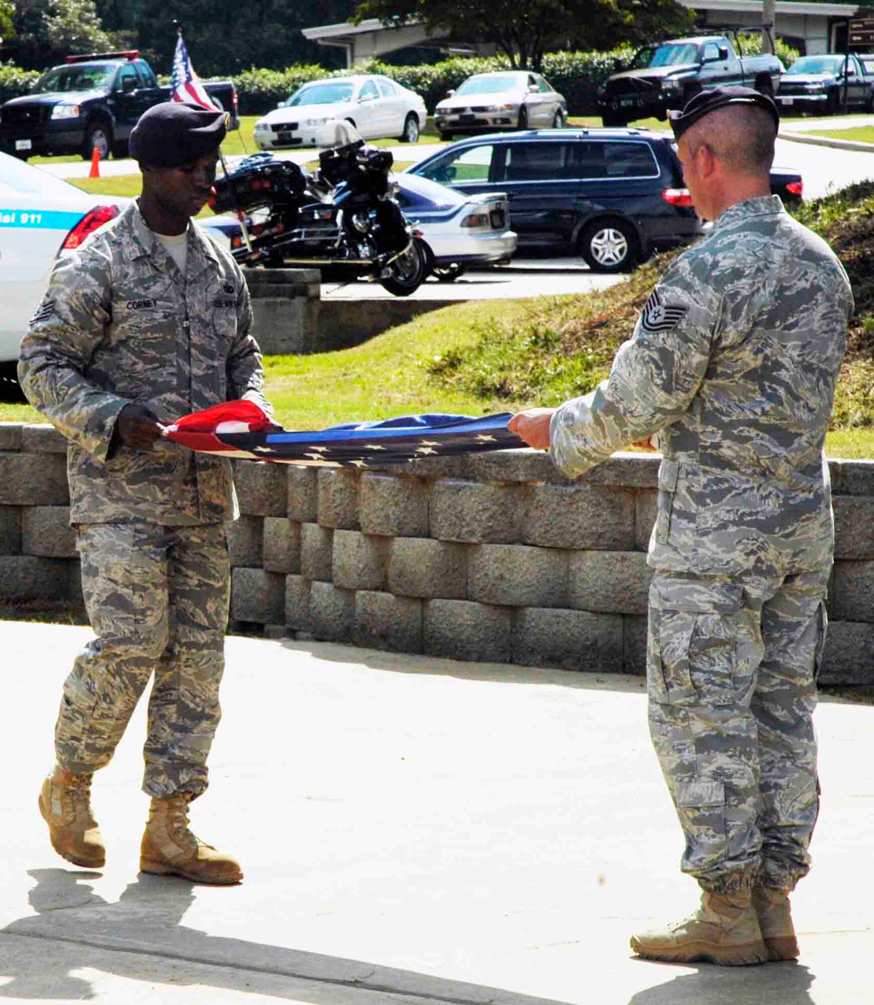 Dobbin’s servicemembers participated in a memorial and retreat ceremony in the POW/MIA Memorial Park here marking the Sept. 11 2001 anniversary. A wreath was presented in honor of the victims.  Afterward the American flag was lowered and symbolically folded. (U.S. Air Force photo/ Senior Airman Danielle Campbell)
