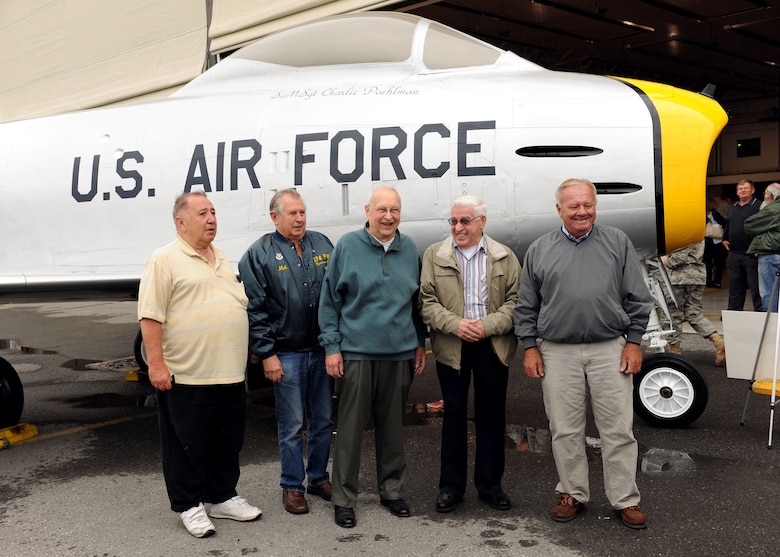 U.S. Air Force Senior Master Sgt. (ret) Charlie Poehlman and other retired members of the 174th Fighter Wing (FW) gather for the dedication of the F-86 Sabre at Hancock Field in Syracuse NY on 12 Sept 2010.   The crew chief side of the aircraft was dedicated to Senior Master Sgt. Poehlman for his years of hard work with the F-86 and the 174th FW.  (Photo by SSgt Ricky Best)