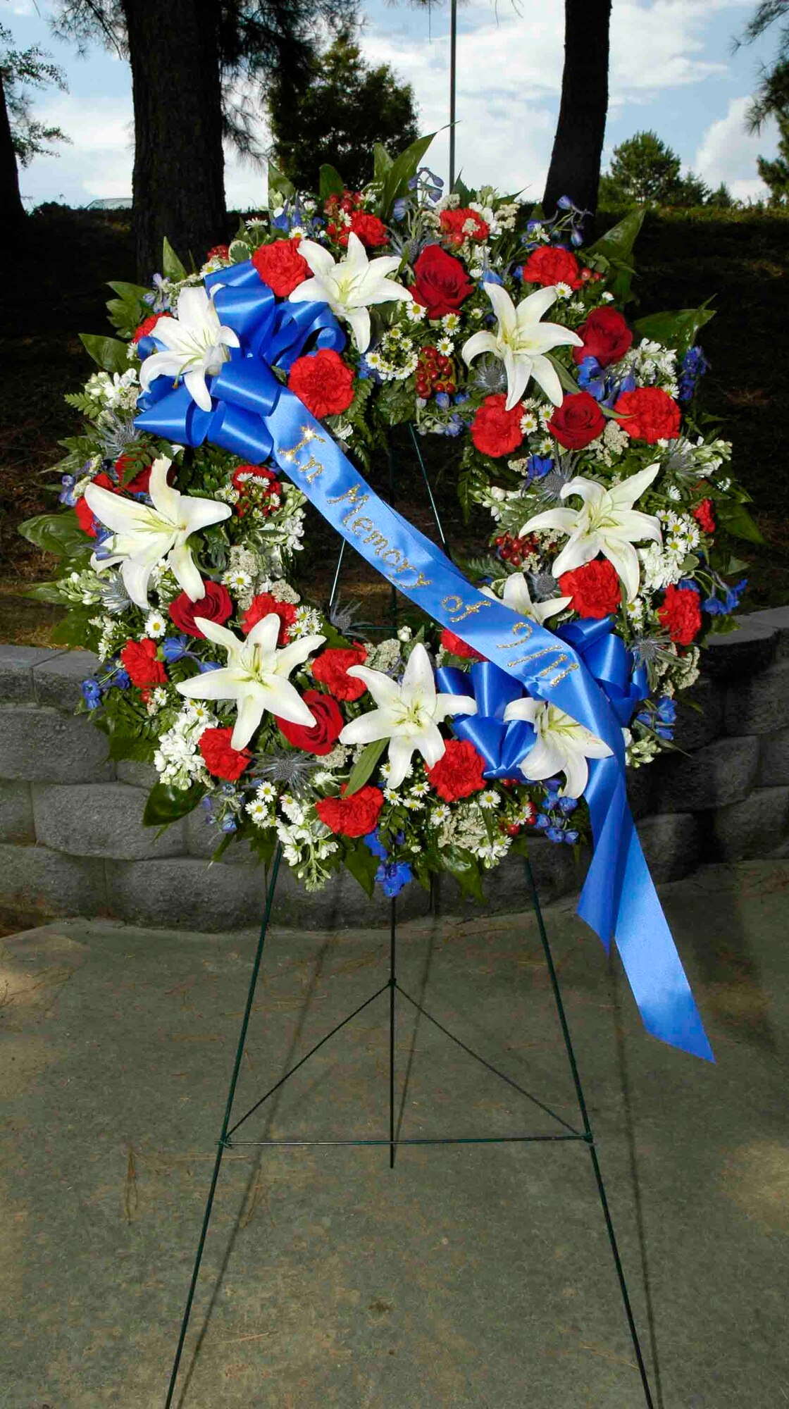 Dobbin’s servicemembers participated in a memorial and retreat ceremony in the POW/MIA Memorial Park here marking the Sept. 11 2001 anniversary. A wreath was presented in honor of the victims.  Afterward the American flag was lowered and symbolically folded. (U.S. Air Force photo/ Senior Airman Danielle Campbell)