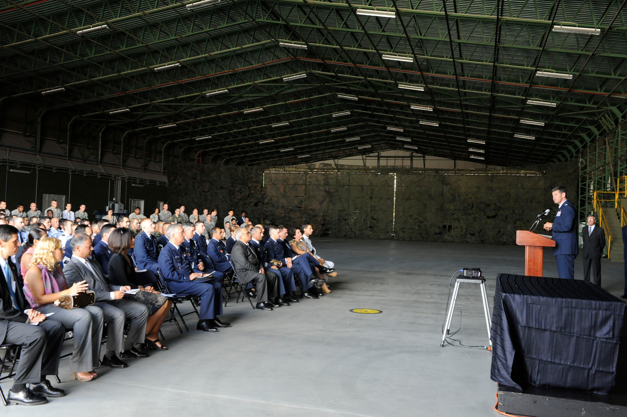 Col. Jose Rivera, 65th Air Base Wing commander, speaks to more than 200 Team Lajes members that  attended the 9/11 ceremony held in the Portuguese South Hanger at Lajes Field Sept. 10, 2010. 