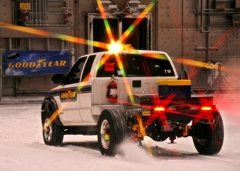A Goodyear test vehicle demonstrates the tire’s traction and gripping capabilities on the snowy test track in the McKinley Climatic Lab Sept. 9 at Eglin Air Force Base, Fla.   The company demonstrated the tire’s snow traction and ice braking capabilities to potential customers from Northern U.S. states and Canada as well as media.  (U.S. Air Force photo/Samuel King Jr.)

