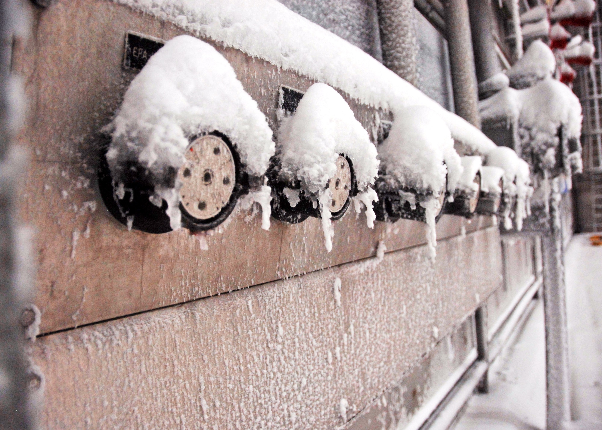 Snow and ice covered instruments on the outside walls of the McKinley Climatic Lab chamber Sept. 9 at Eglin Air Force Base, Fla.  The chamber was cooled to 20 degrees and snow and ice were created in preparation for tests by Goodyear Tire and Rubber Company.  The tests demonstrated its latest tire’s snow traction and ice braking capabilities.  (U.S. Air Force photo/Samuel King Jr.)