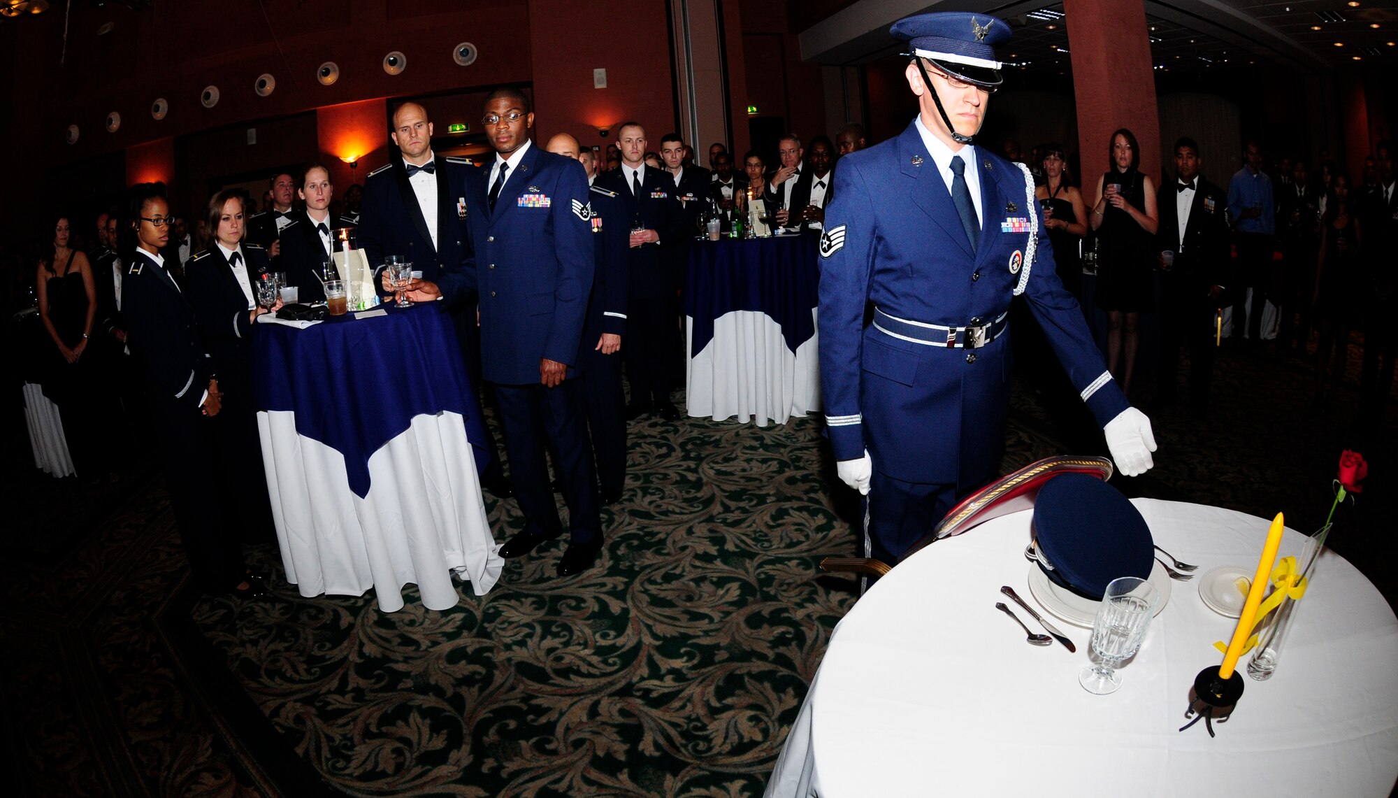 Guests of Aviano’s 63rd Air Force Ball prepare to raise their water glasses in toast to the traditional prisoner of war and missing in action table ceremony Sept. 10 at the La Bella Vista Club. The event which honored the anniversary of the Air Force becoming its own branch in the U.S. military on Sept. 18, 1947,  provided a special social occasion for the Air Force community based on the theme "Celebrating Partnership: Passato e Presente." (U.S. Air Force photo/Airman 1st Class Katherine Windish)