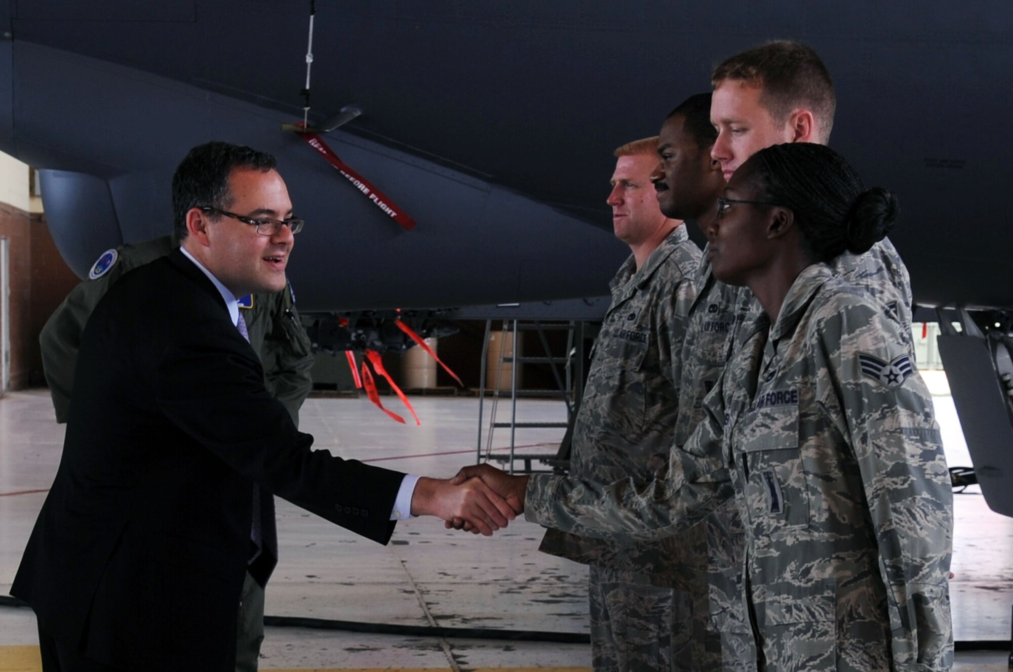 Assistant Secretary of the Air Force for Manpower and Reserve Issues, Honorable Daniel B. Ginsberg, greets (from left) Tech. Sgt. John Paxton, Senior Airman Eddie Isom, Staff Sgt. Jason Sperry and Senior Airman Holly Guerra Sept. 9 during a tour of a B-52. The weapons loaders are part of the total force integration effort at Barksdale supporting the Flight Training Unit for the B-52. Mr. Ginsberg visited Barksdale Sept. 9-10 to meet with key Air Force Global Strike Command leaders and meet the Airmen of the Command. (U.S. Air Force photo/Airman 1st Class Brittany Bateman)
